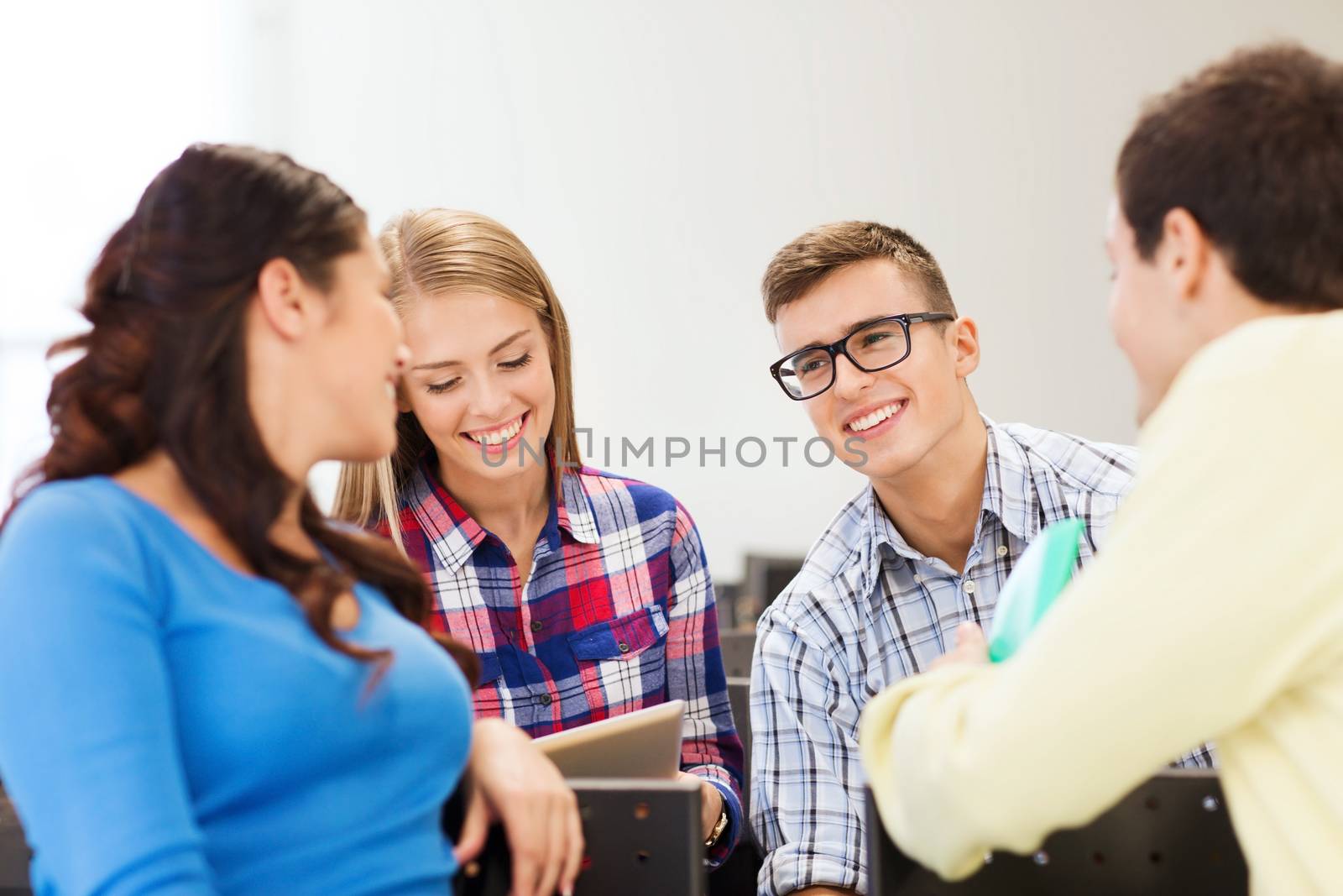 group of smiling students in lecture hall by dolgachov