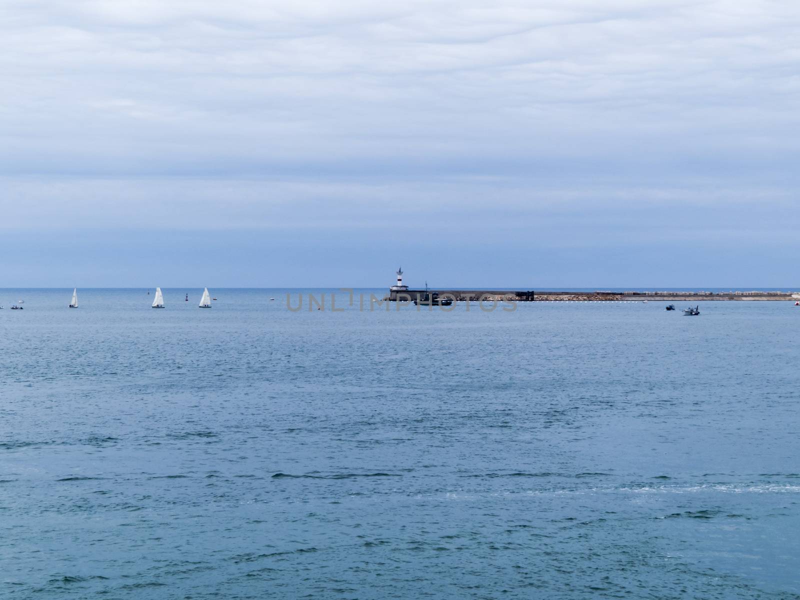 Sea bay in the city in cloudy weather