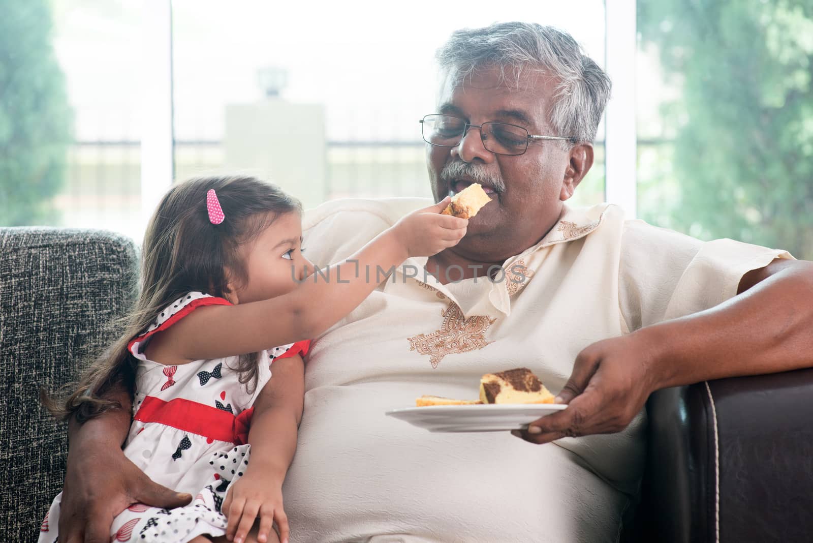 Granddaughter feeding grandfather cake by szefei