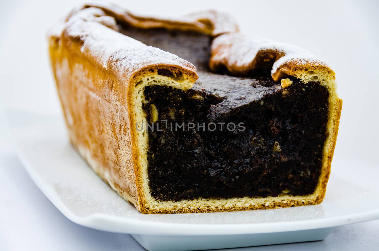 Poppy seed cake isolated on white background