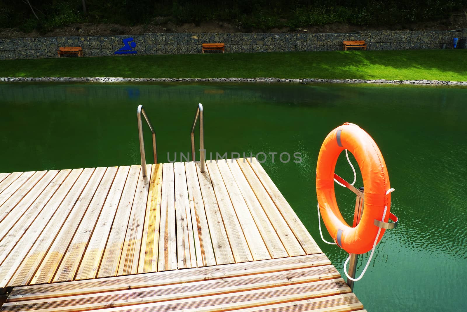 Deck on swimming pool in nature