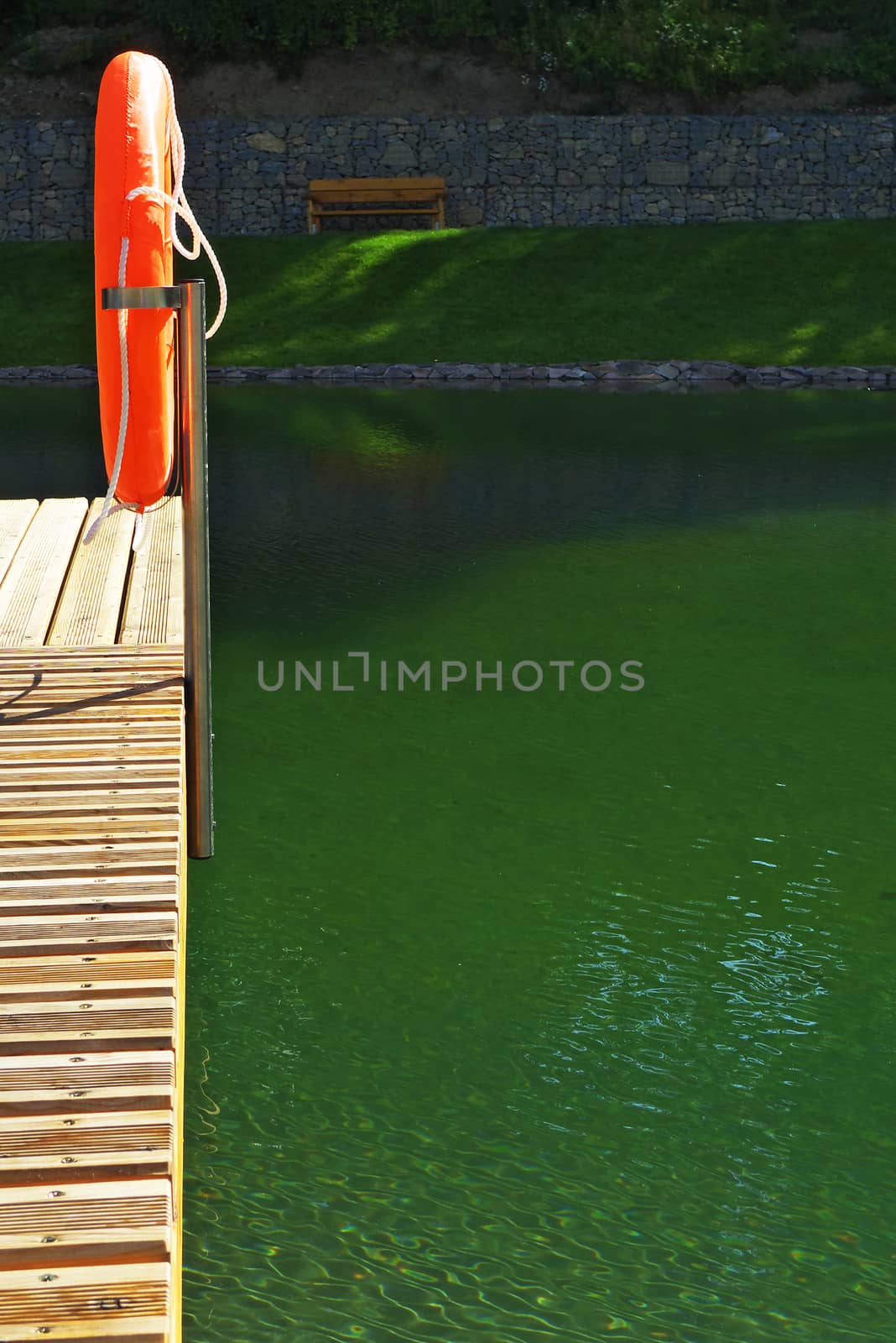 Deck on swimming pool in nature