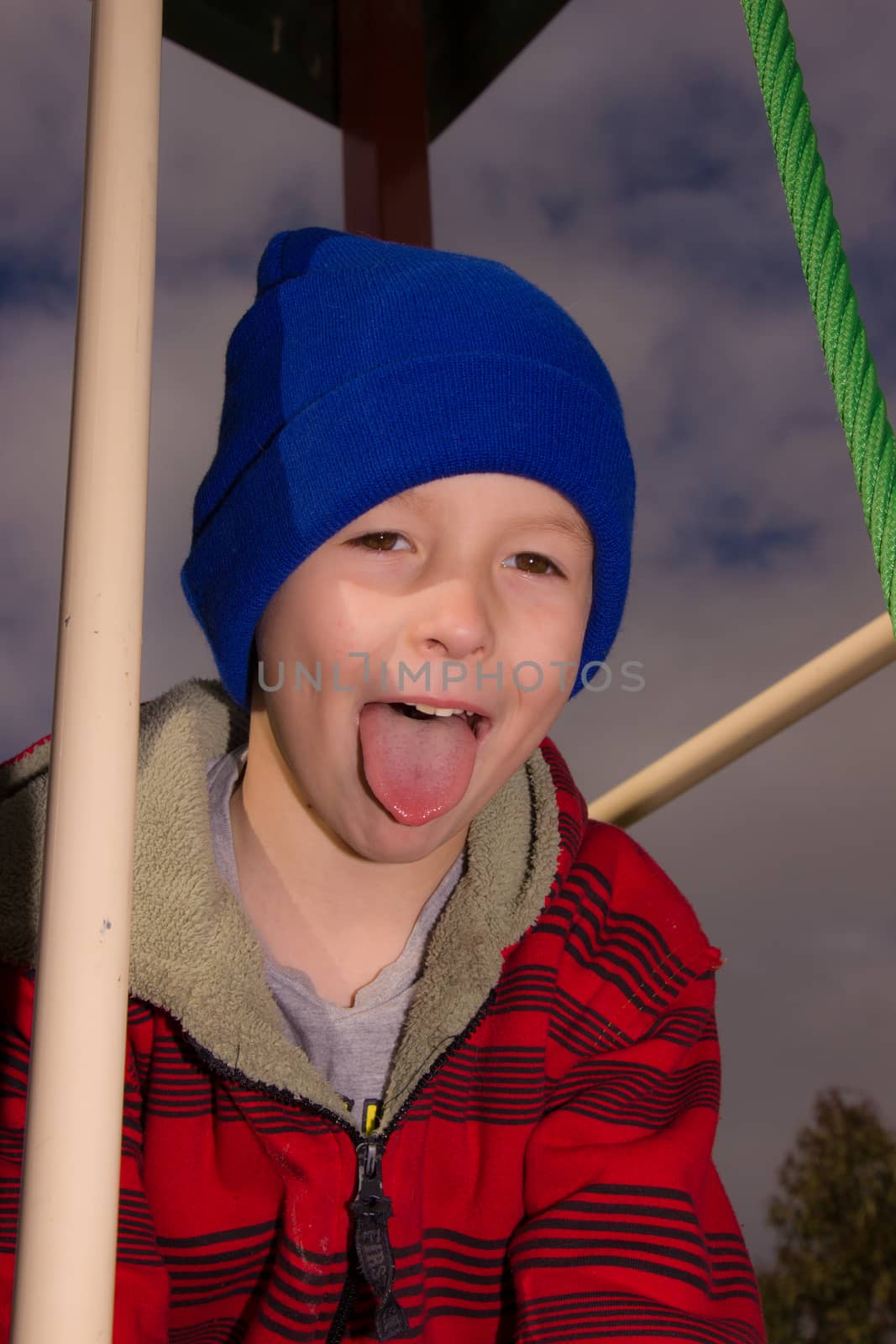 Boy with tongue out by davidhewison