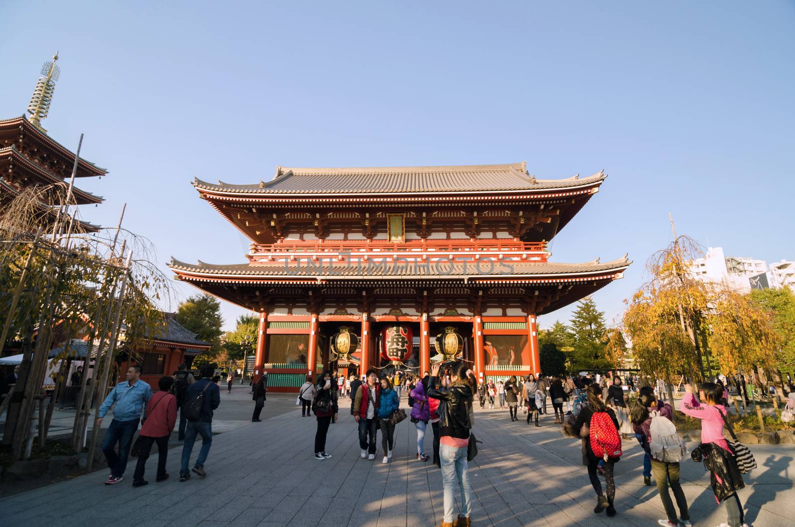 Tokyo, Japan - November 21, 2013: Tourists Visit Buddhist Temple Senso-ji is the symbol of Asakusa and attracting thousands of tourists on November 21, 2013 in Tokyo, Japan. 