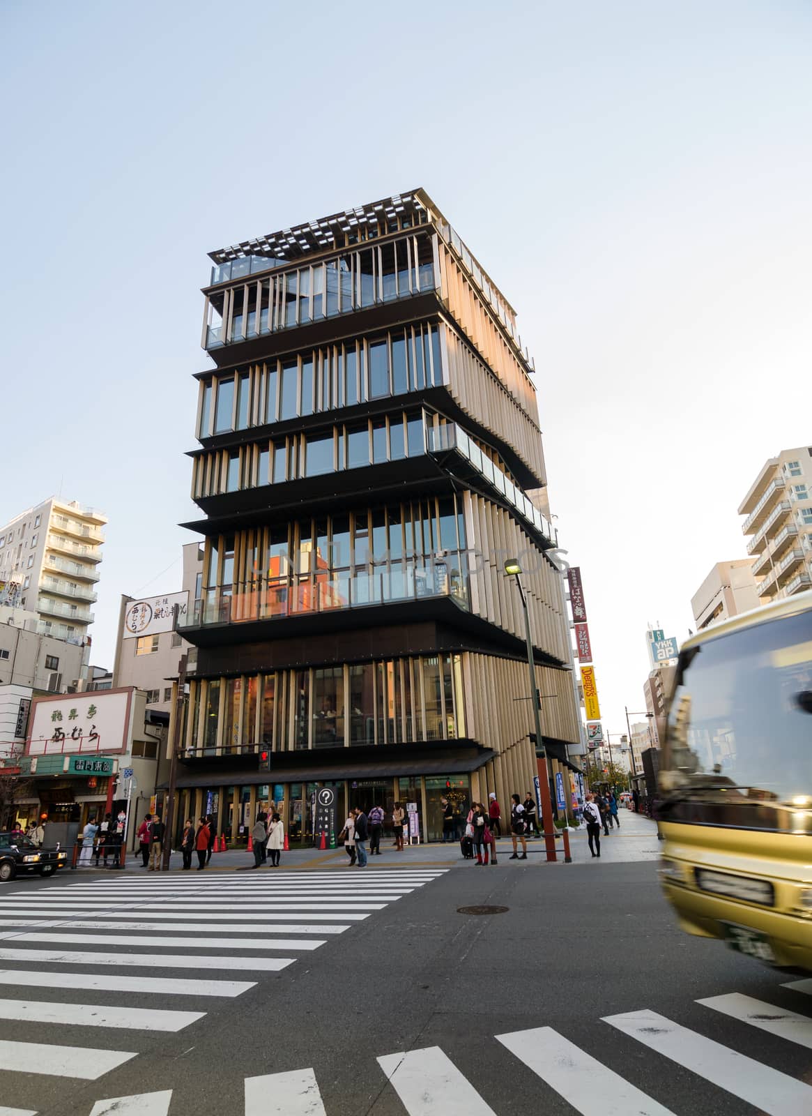 Tokyo, Japan - November 21, 2013: Unidentified tourists around Asakusa Culture Tourist Center on November 21, 2013 in Tokyo,Japan, the building was required to accommodate plural programs such as tourist information center, conference room, multi-purpose hall and an exhibition space.