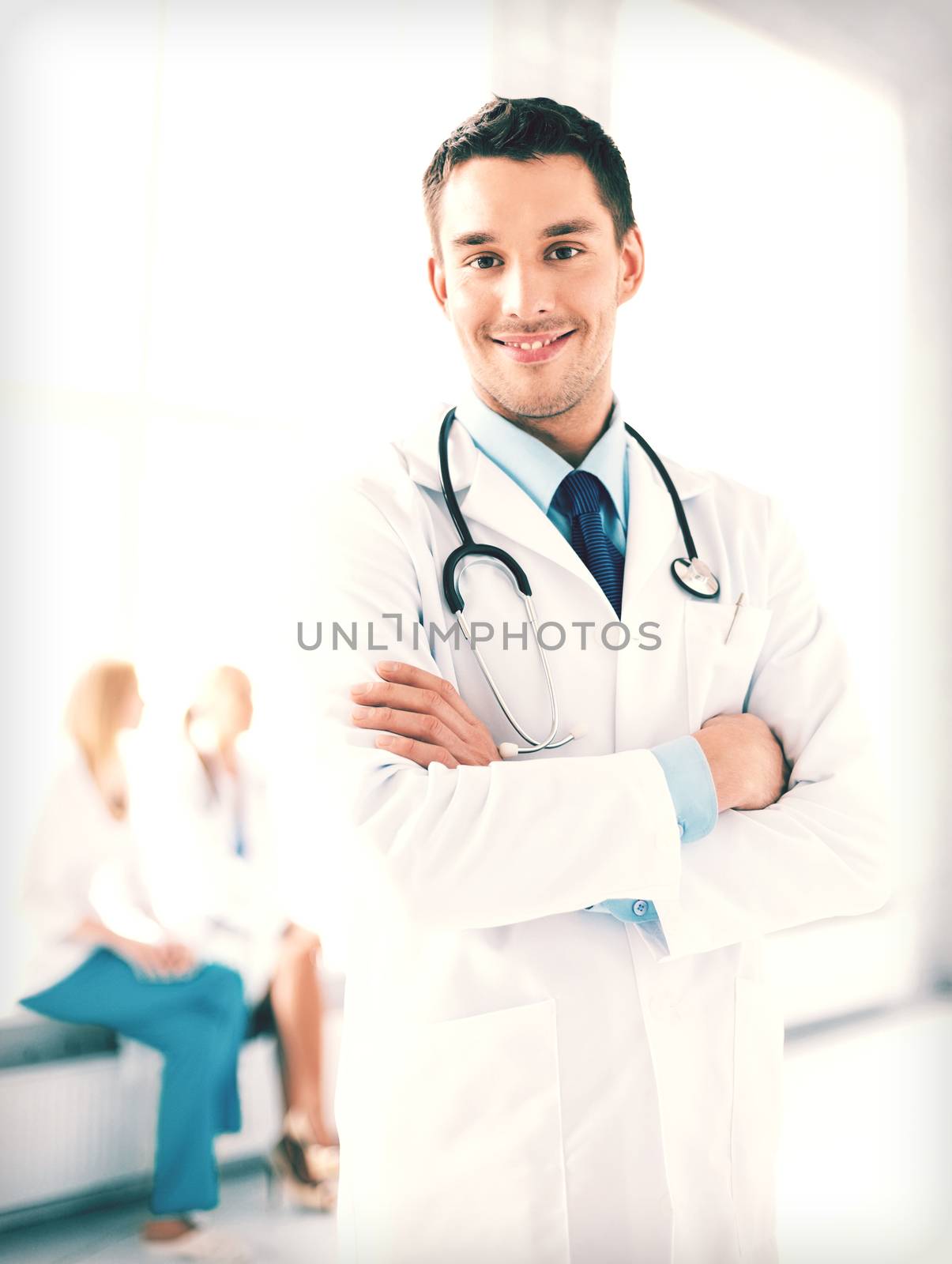 male doctor with stethoscope by dolgachov