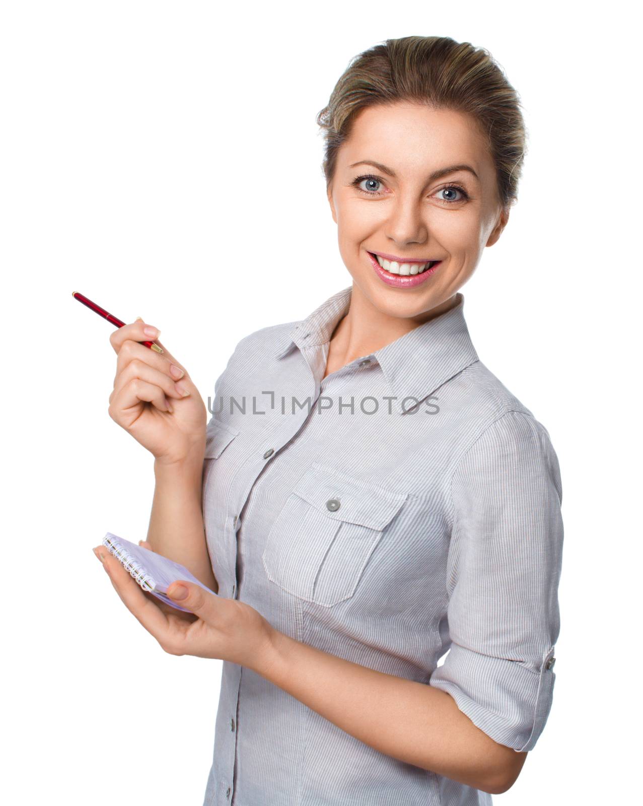 Young beautiful woman holds pen and notebook isolated over white
