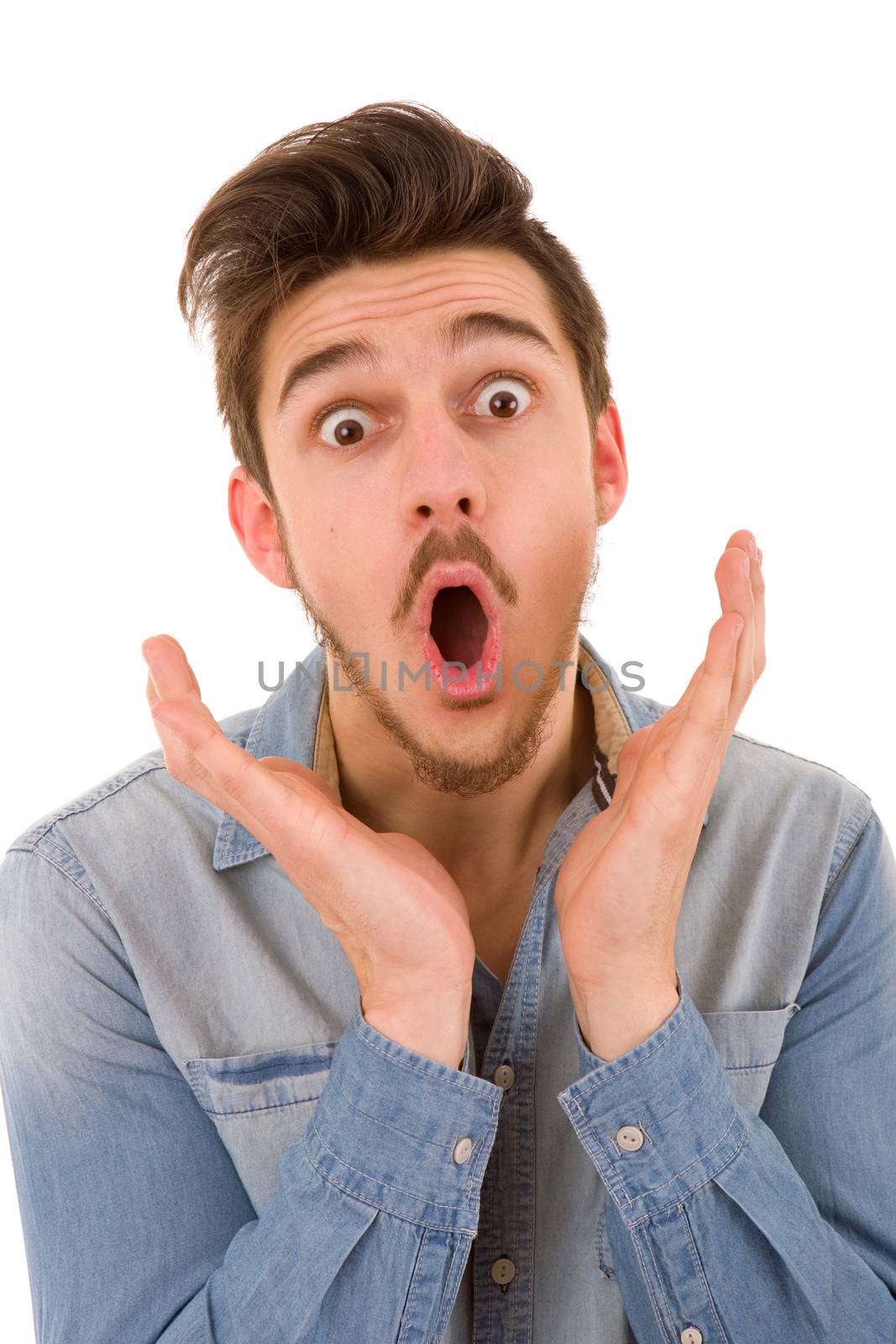 young casual surprised man portrait in a white background