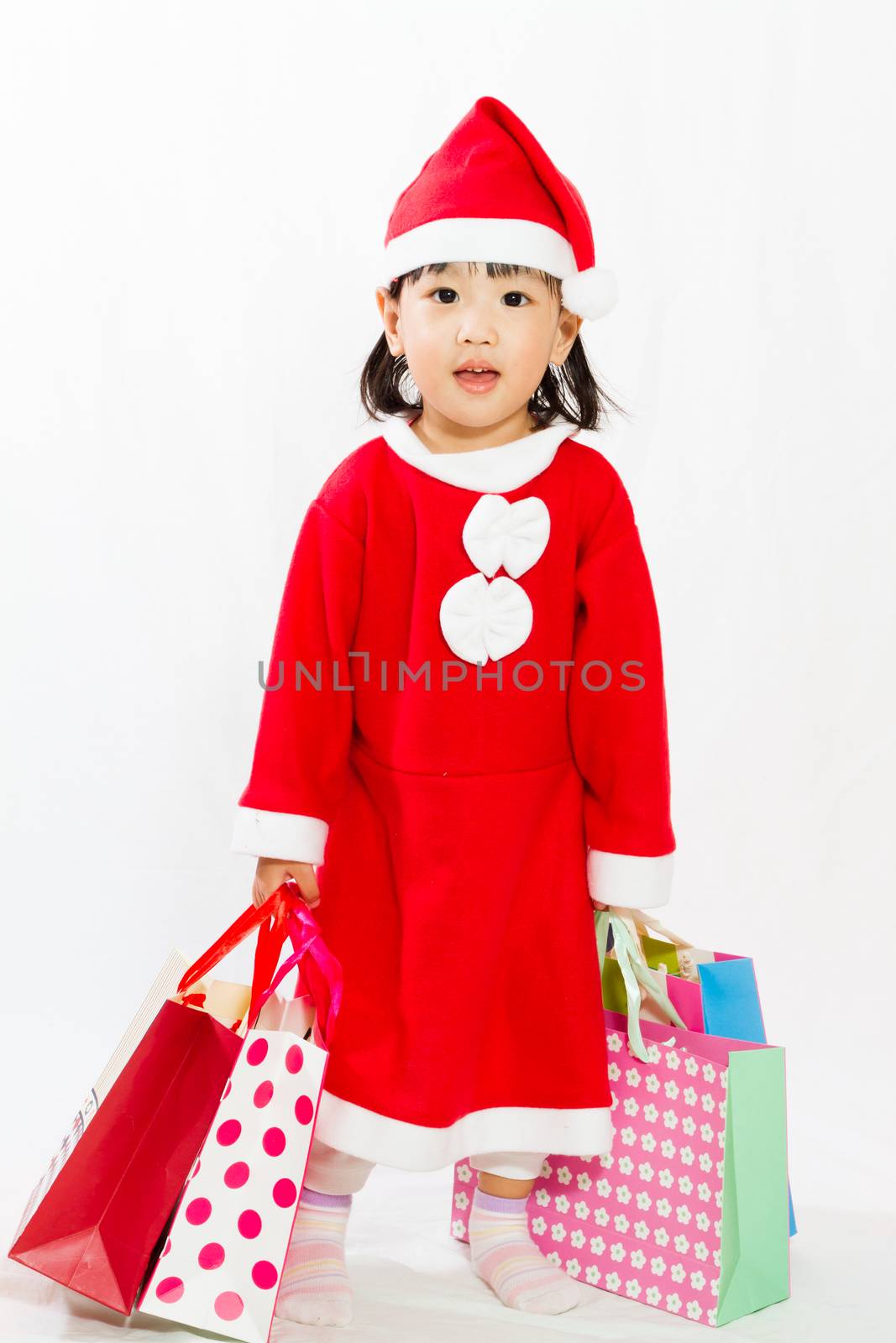 Asian Little Santa Claus with shopping bag in white isolated background