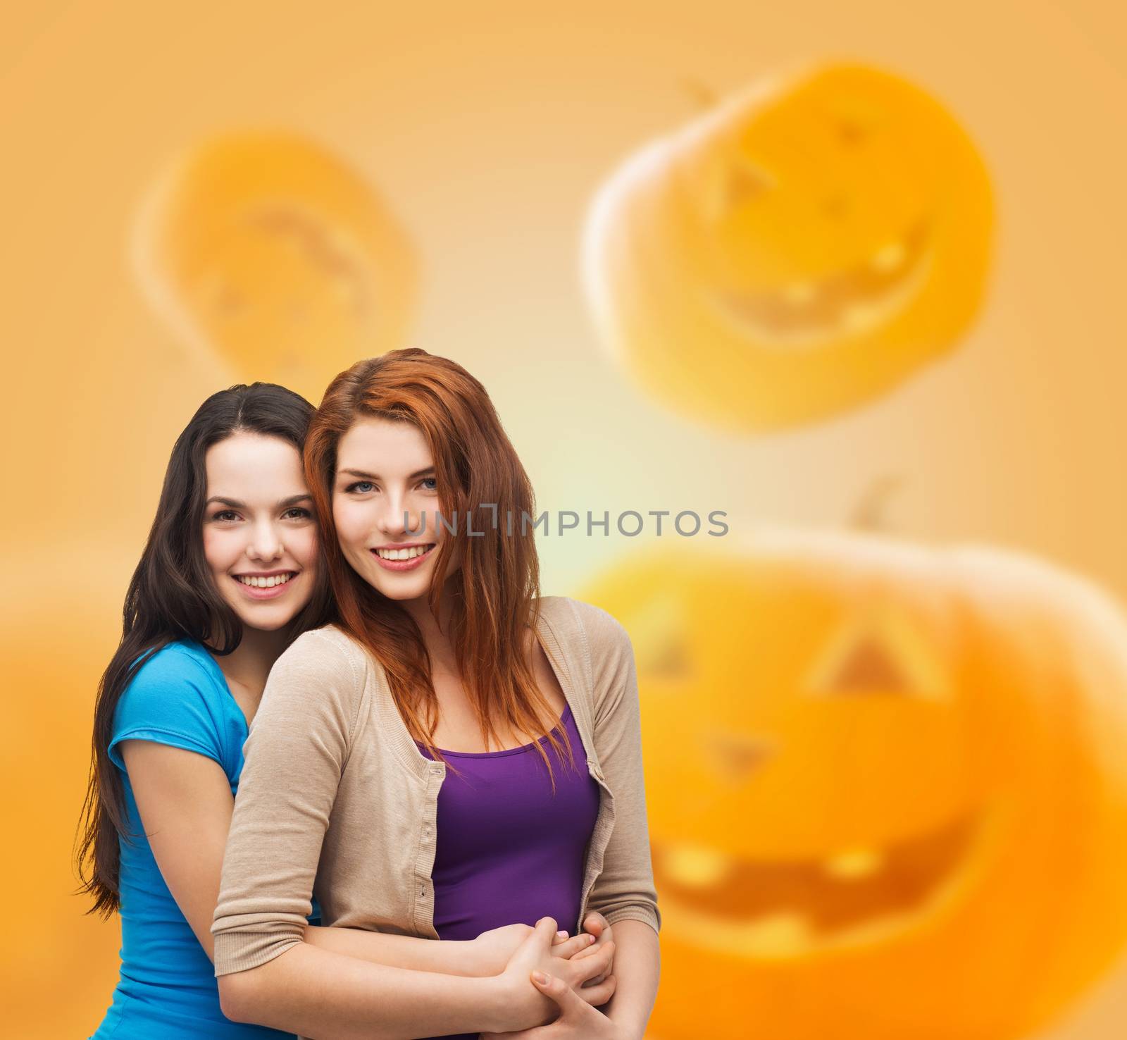 smiling teenage girls hugging by dolgachov