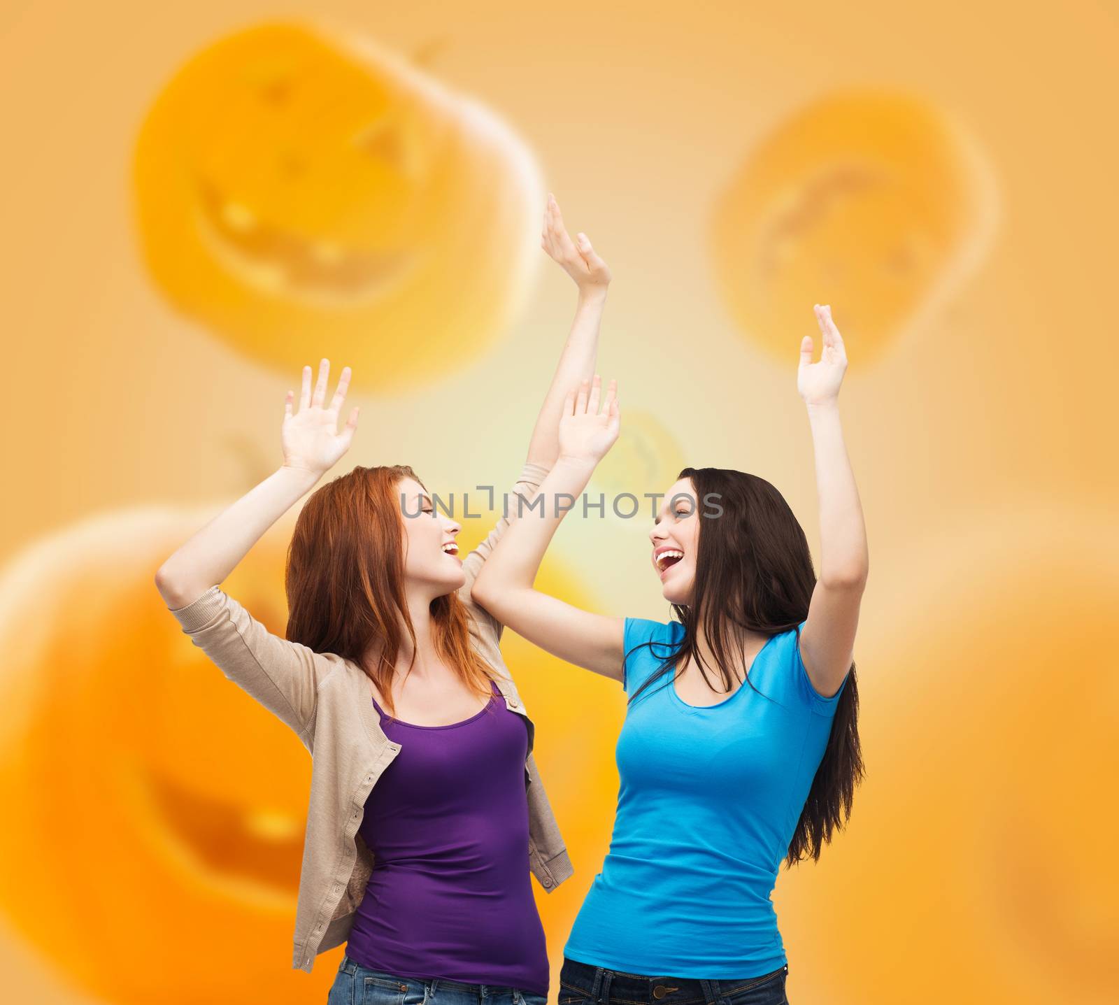 smiling teenage girls having fun by dolgachov
