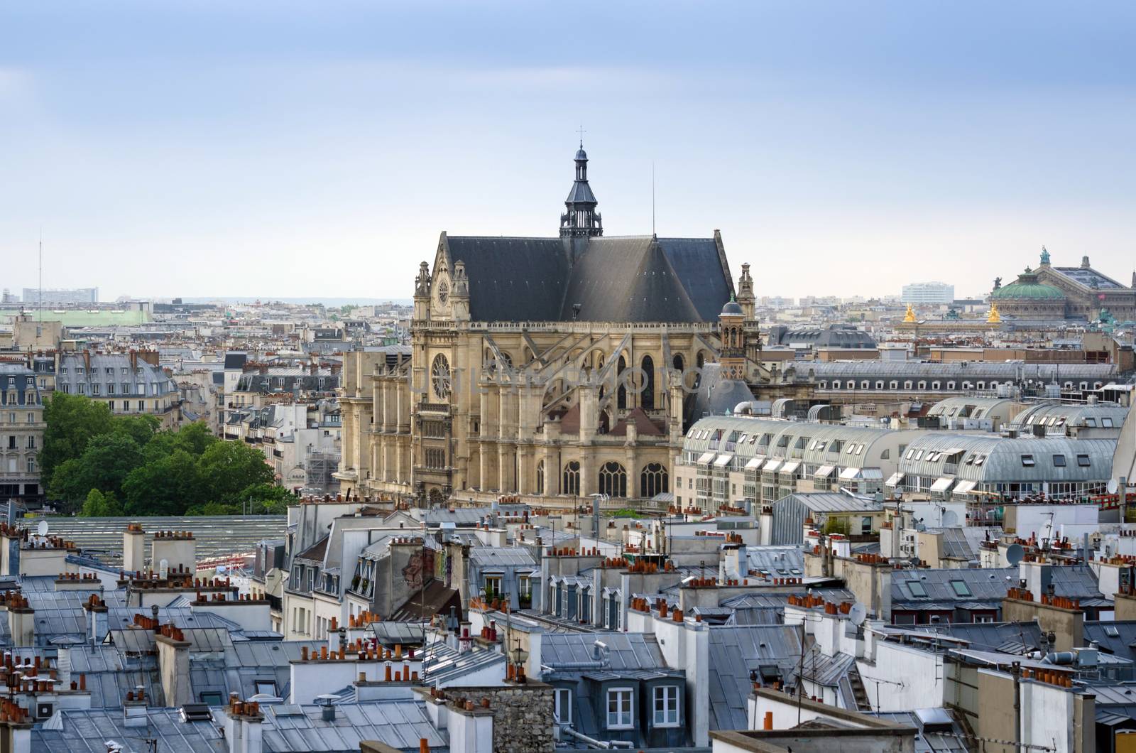 Saint-Germain l'Auxerrois church with Paris Skyline. View form Pompidou Center