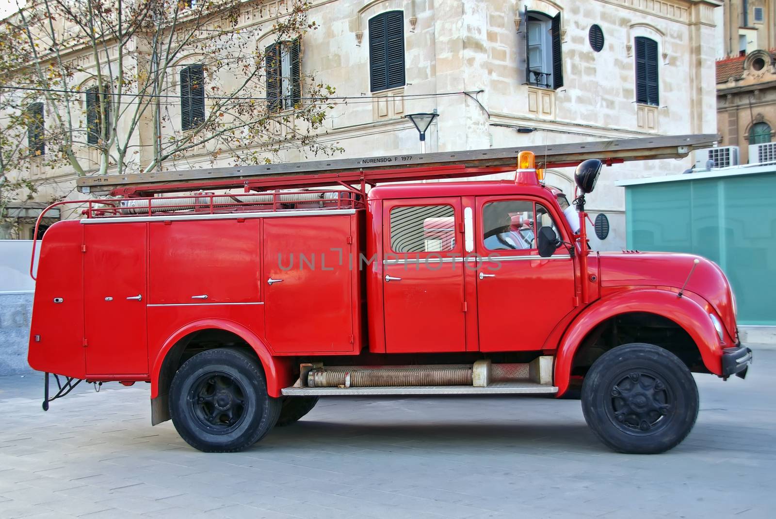 Old red firemen truck in an exhibition