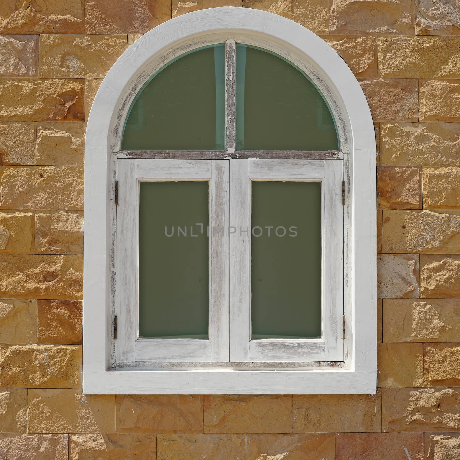 vintage window on stone wall