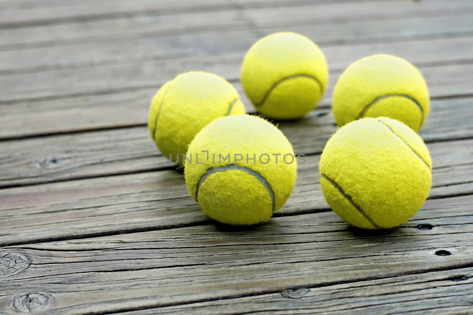 exotic yellow tennis ball  on wooden background