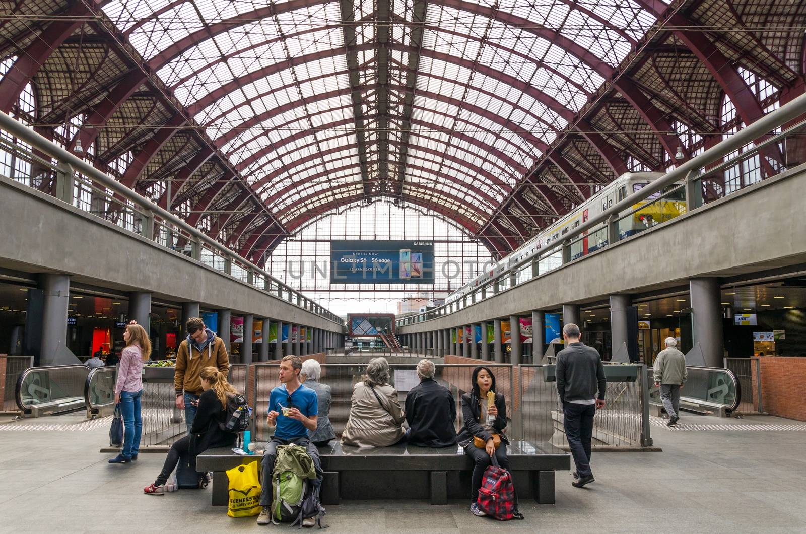 Antwerp, Belgium - May 11, 2015: People in Main hall of Antwerp Central station by siraanamwong