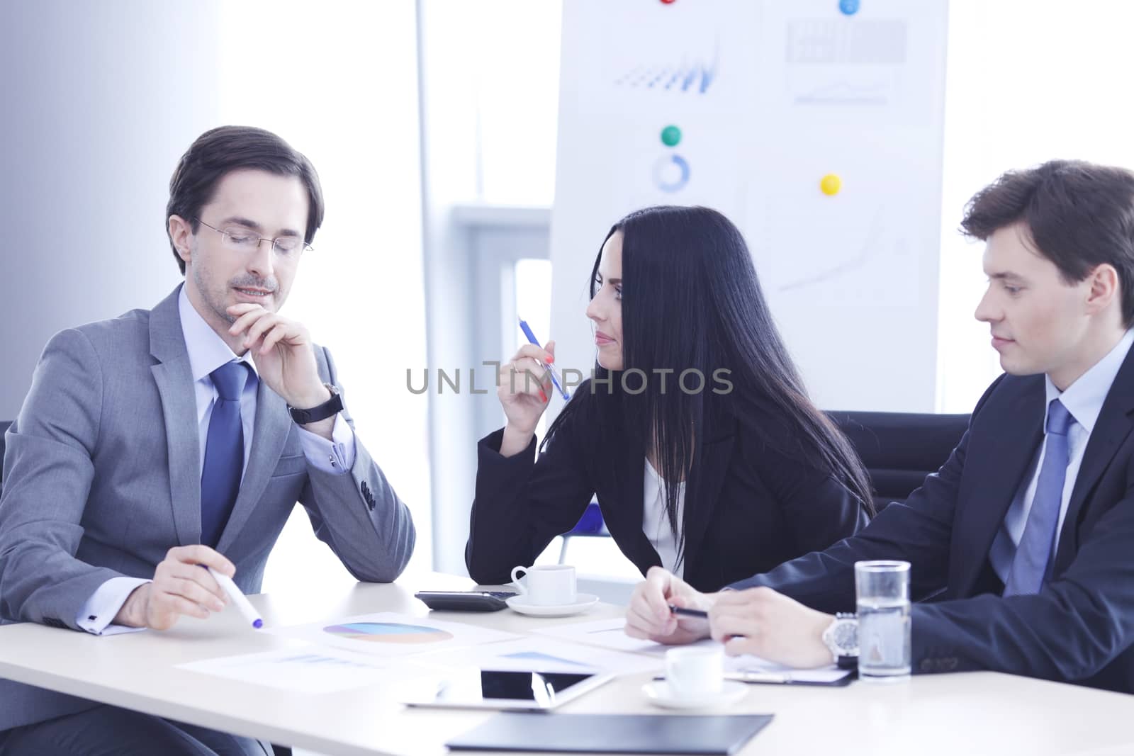 Business people discussing financial reports during a meeting