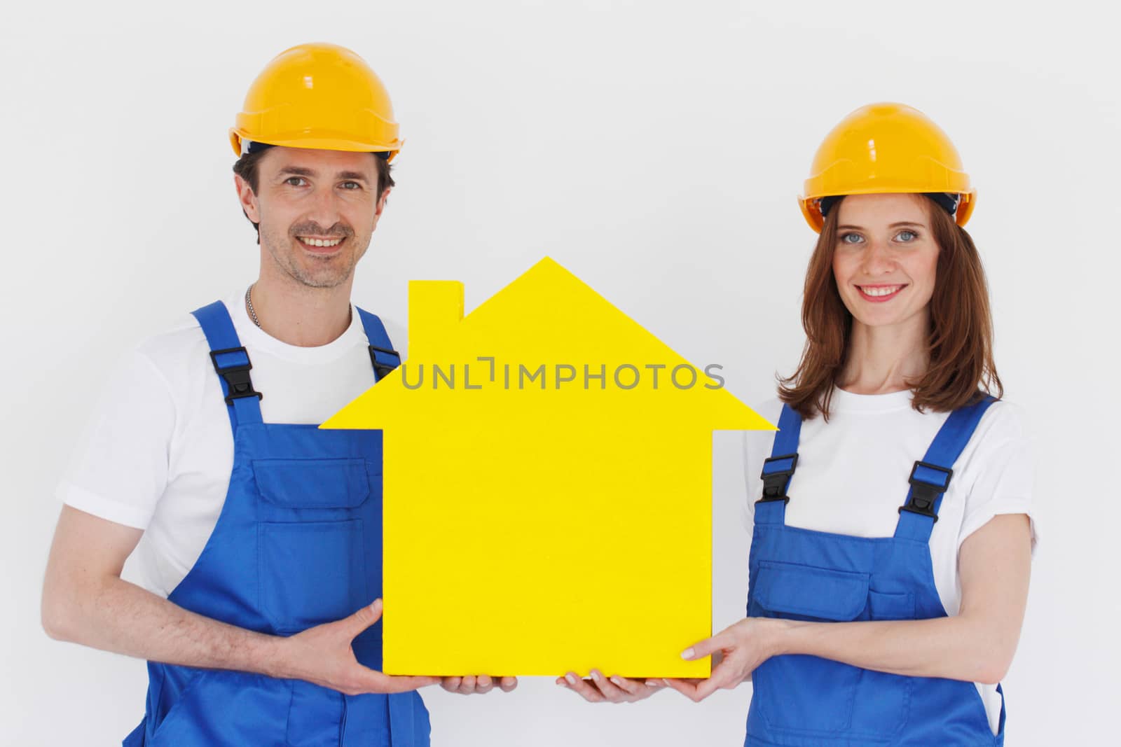 two workmen holding yellow house symbol