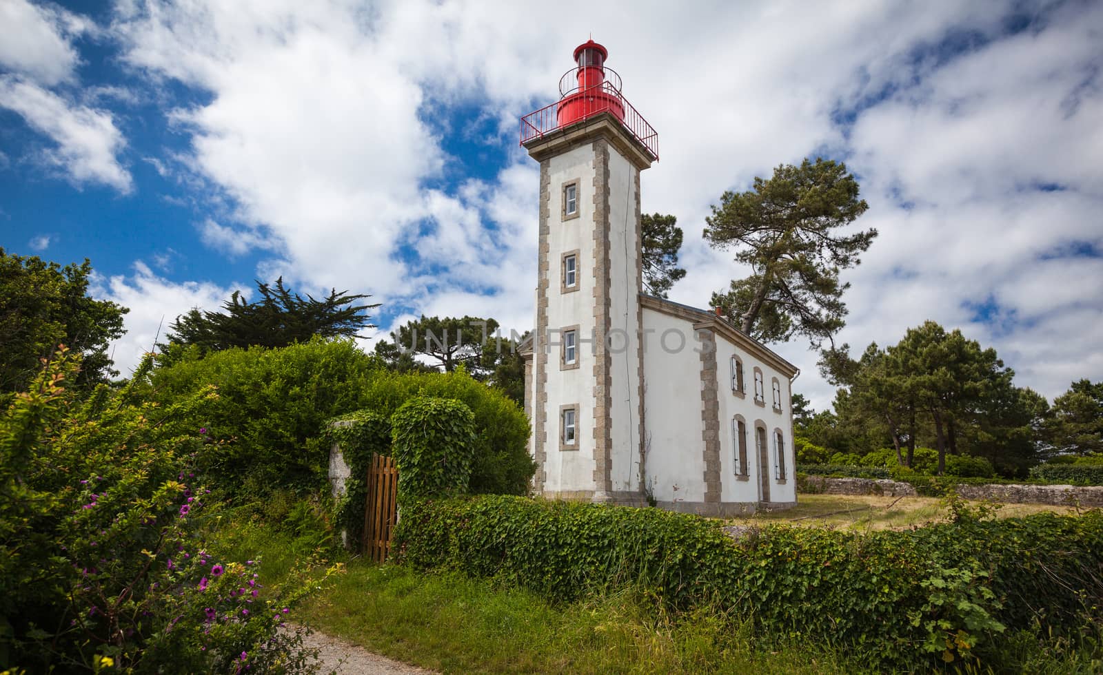 stone house and lighthouse at the mouth of the Odet