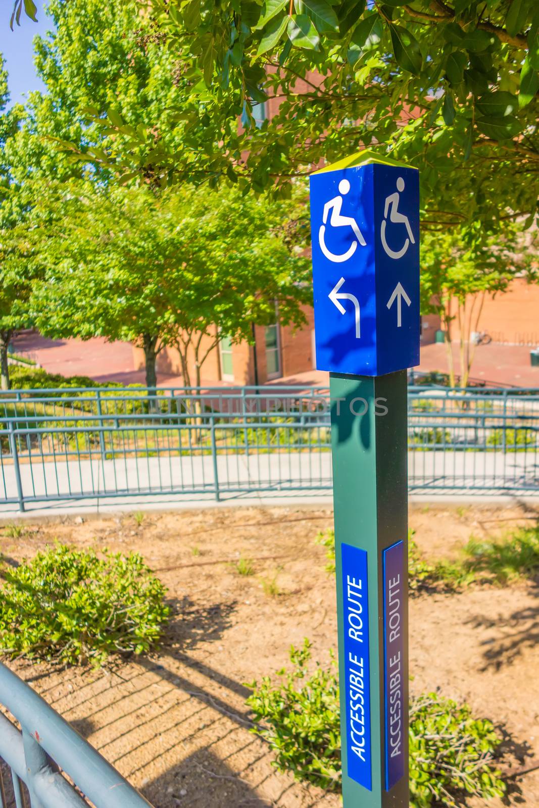 blue handicapped wheel chair post sign