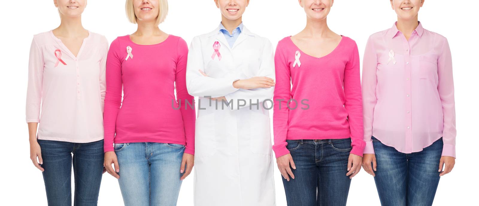 close up of women with cancer awareness ribbons by dolgachov