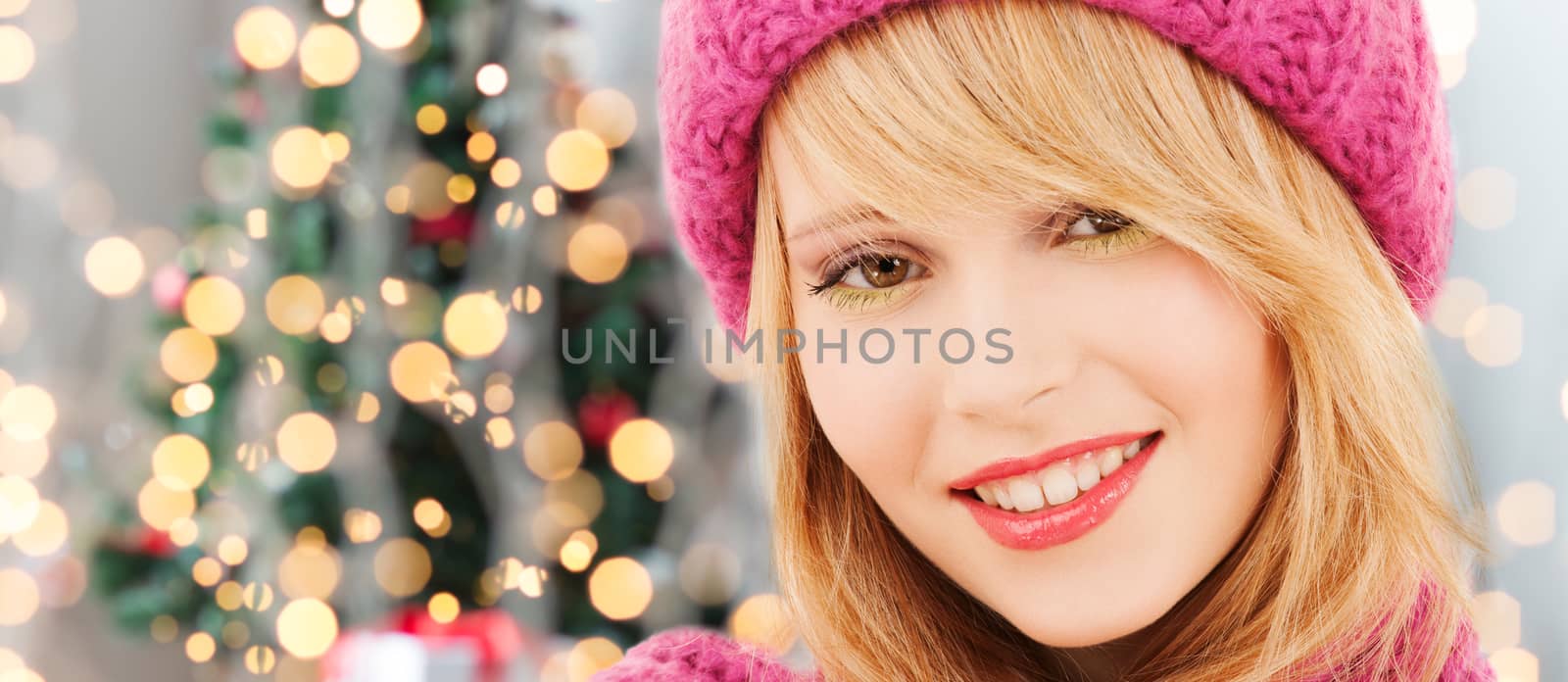 close up of smiling young woman in winter clothes by dolgachov