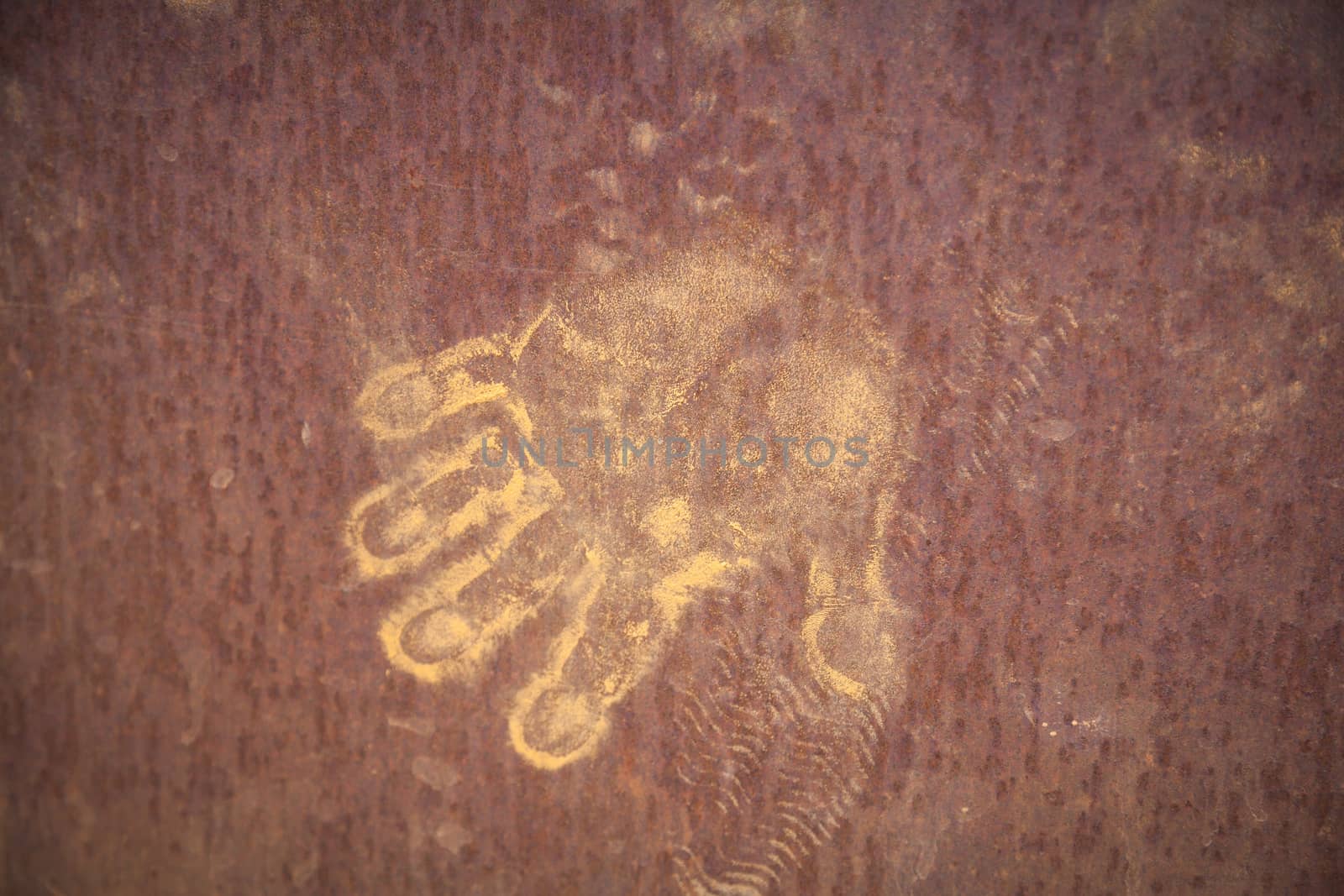 Handprints in ocher in Roussillion in Provence famous for the ocher quarries