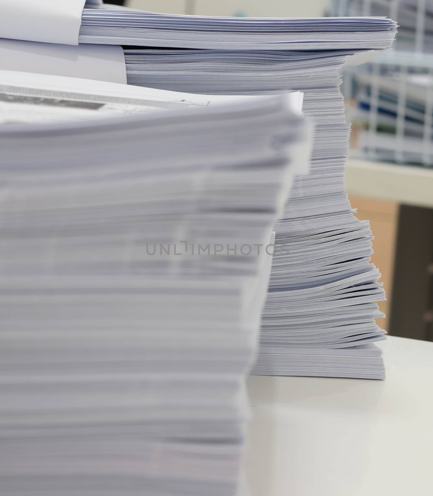 Paper sheets placed on desk at office by ninun