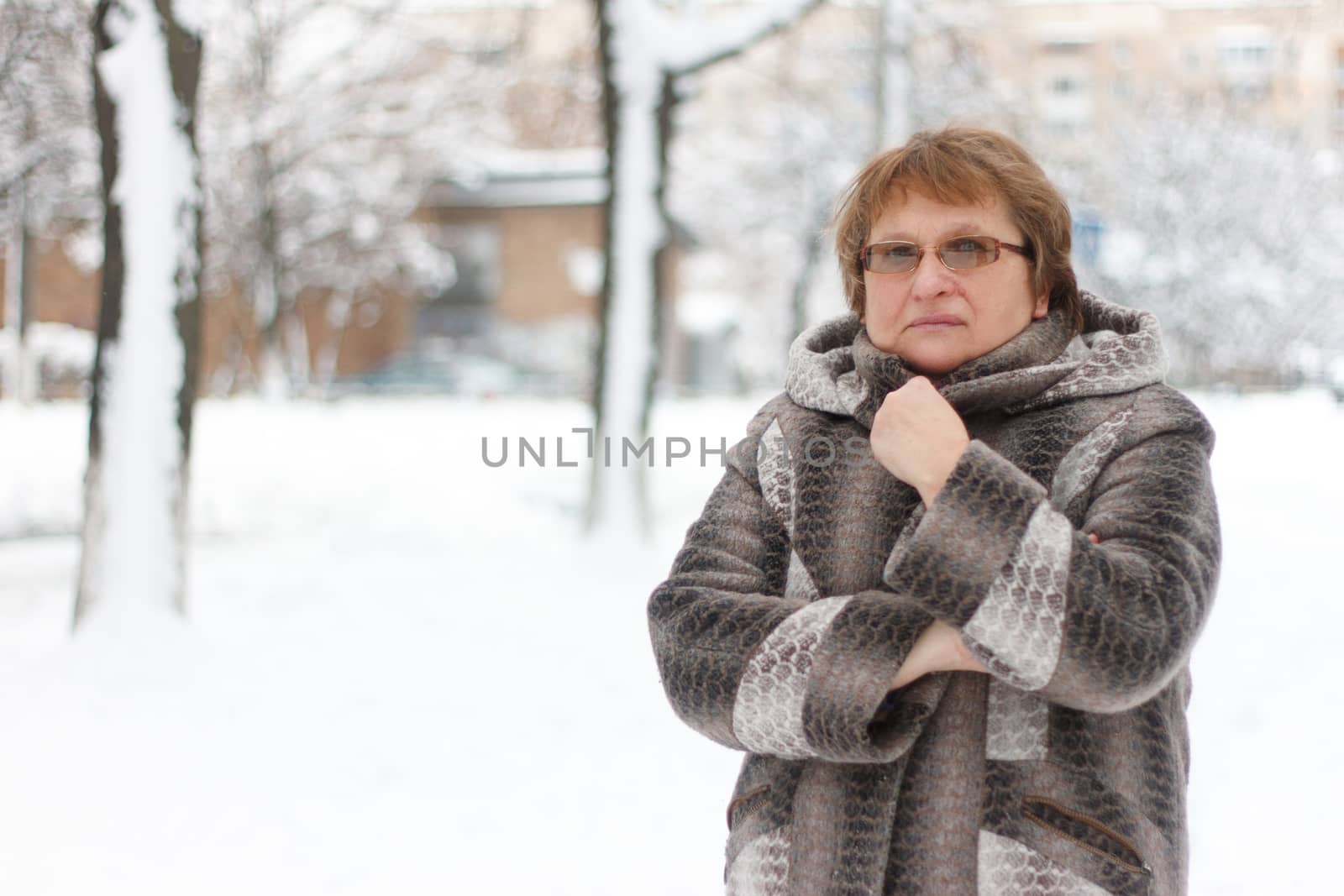 Portrait of  mature woman in winter park