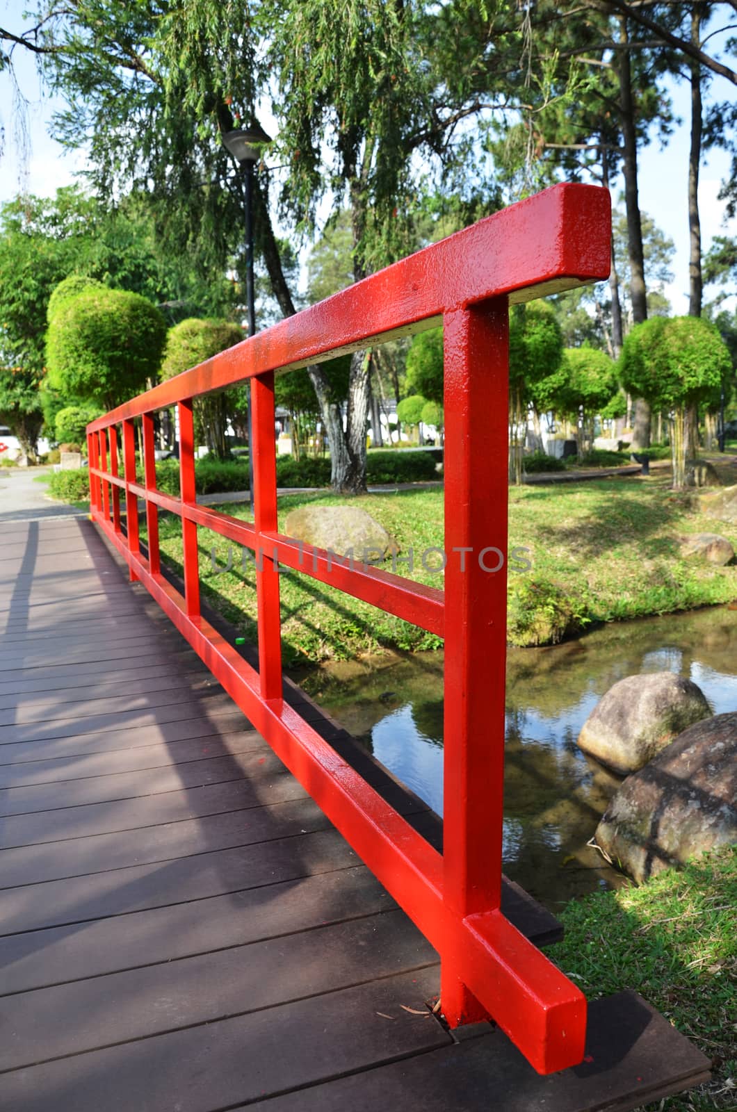 Red bridge in Chinese Garden by tang90246