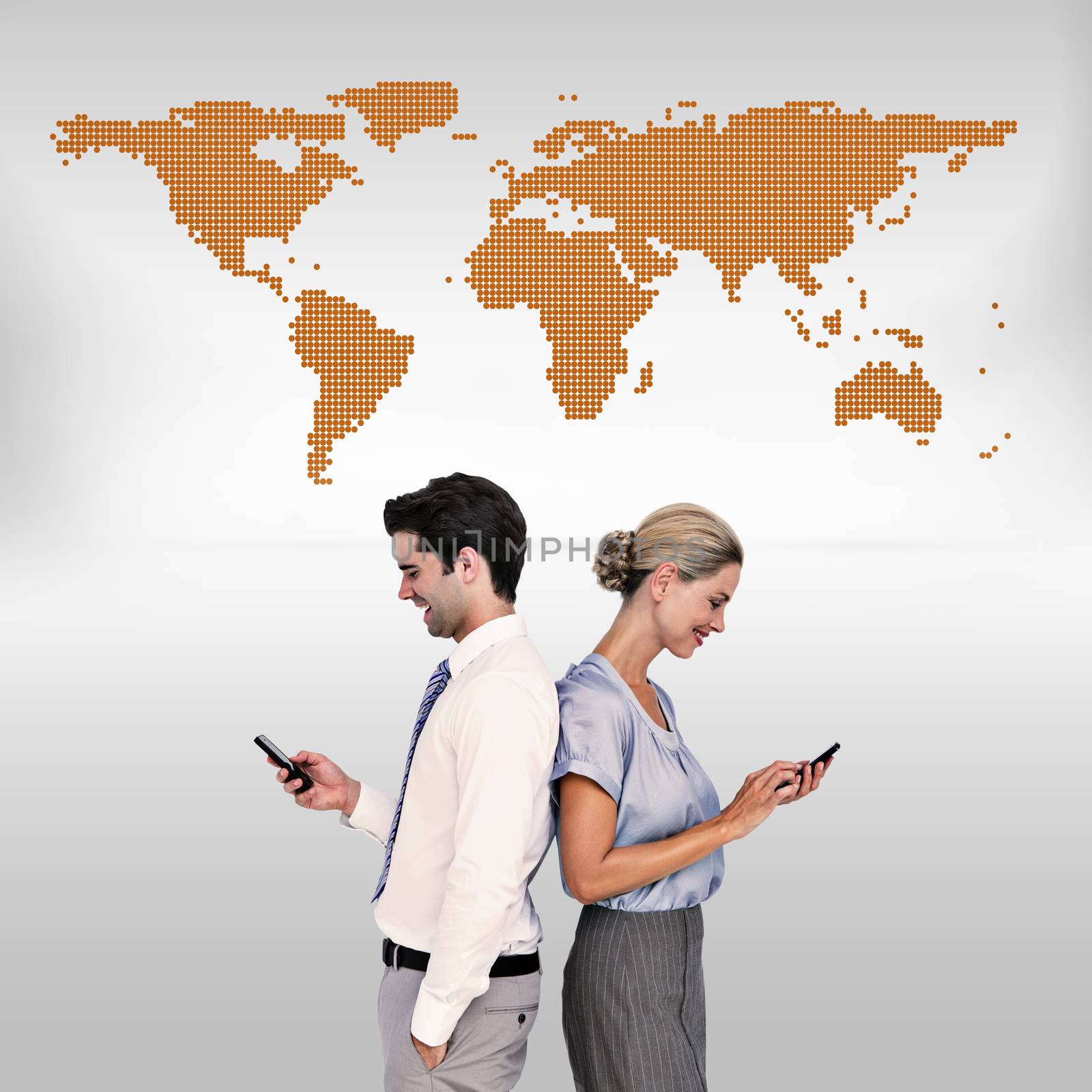 Business people using smartphone back to back against orange world map on white background