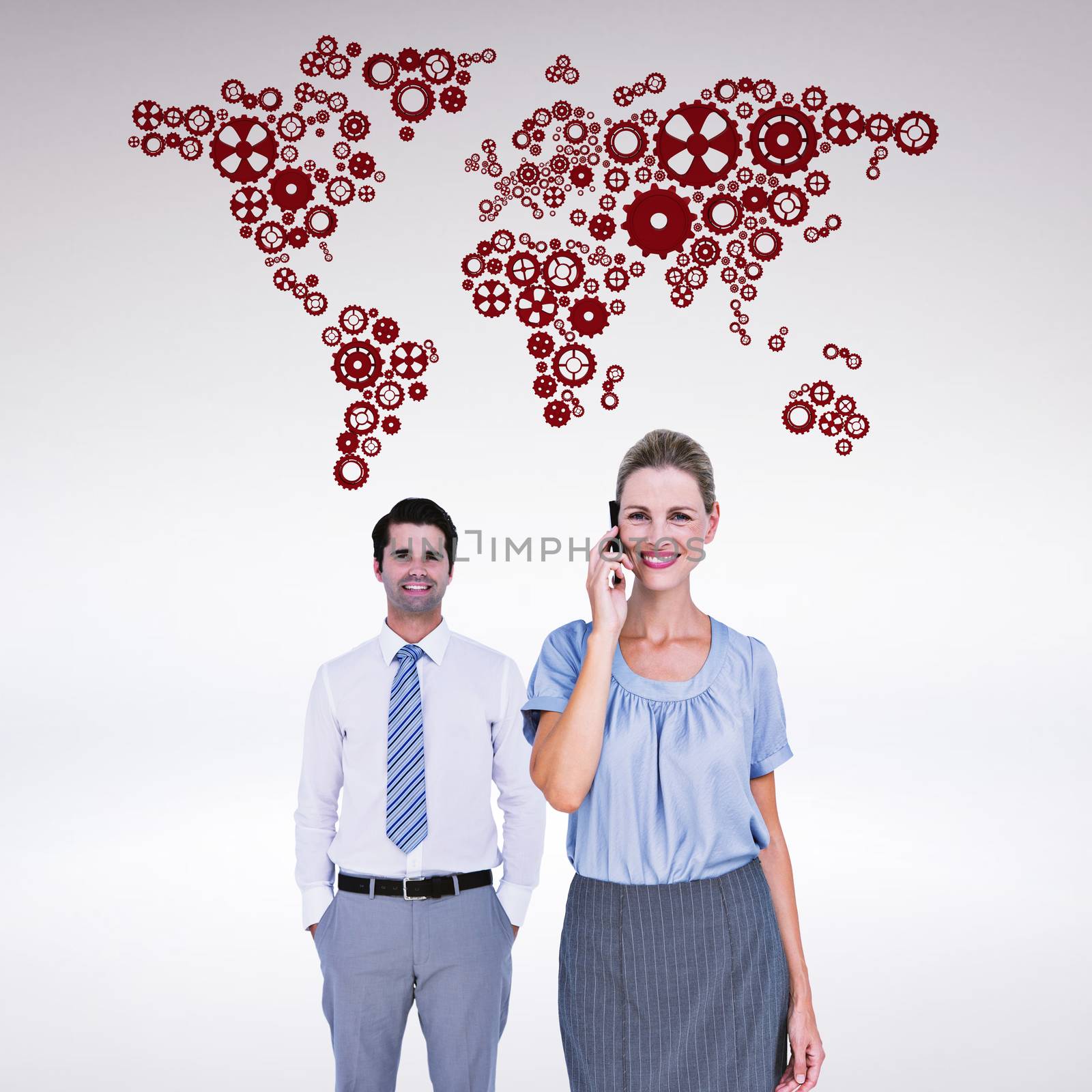 Composite image of businesswoman having phone call while her colleague posing by Wavebreakmedia