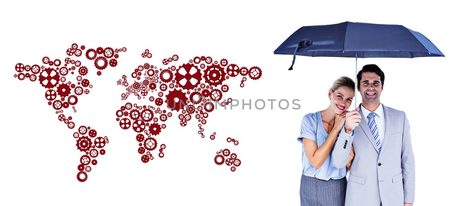 Business people holding a black umbrella against map made of cogs