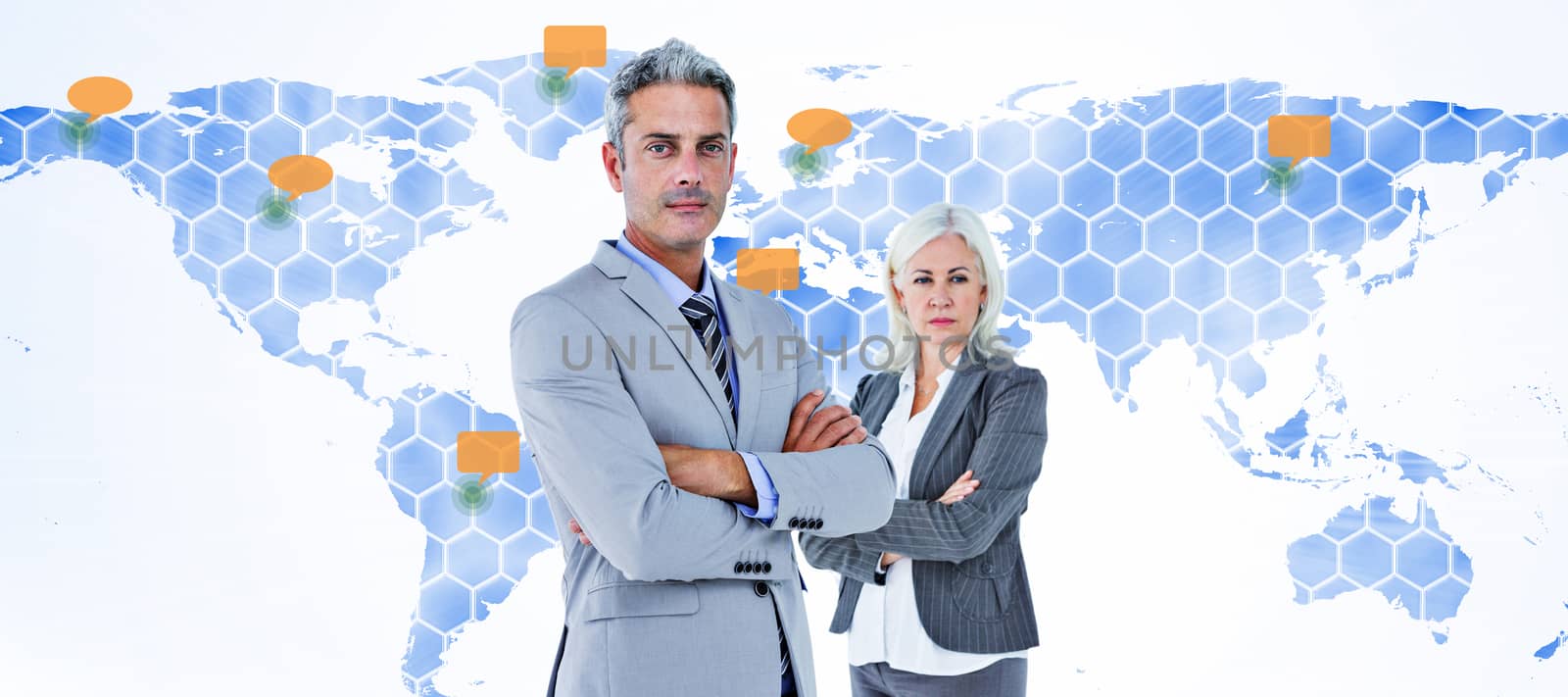  Smiling businesswoman and man with arms crossed against world map 