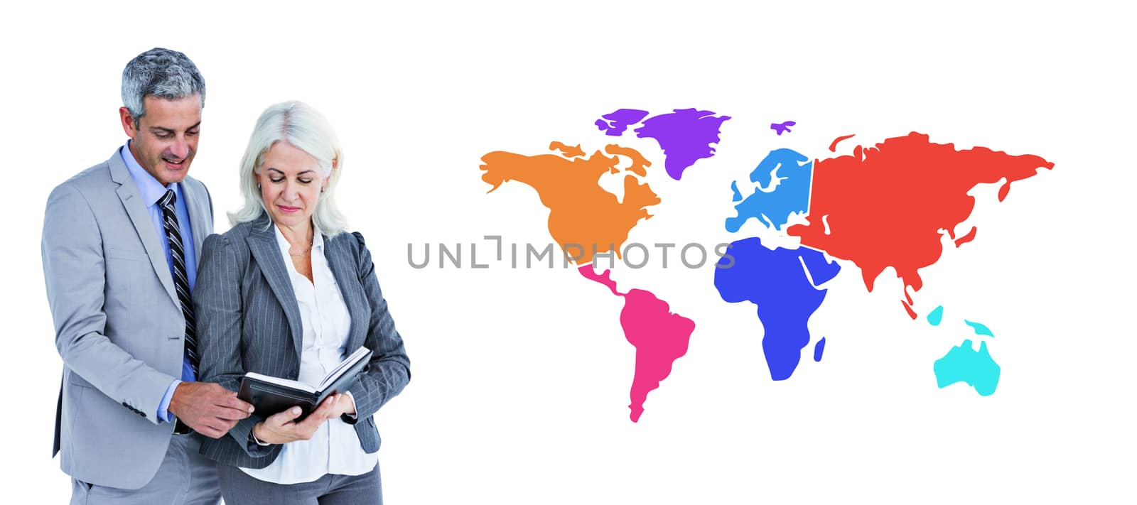  Smiling businesswoman and man with a notebook against colourful world map