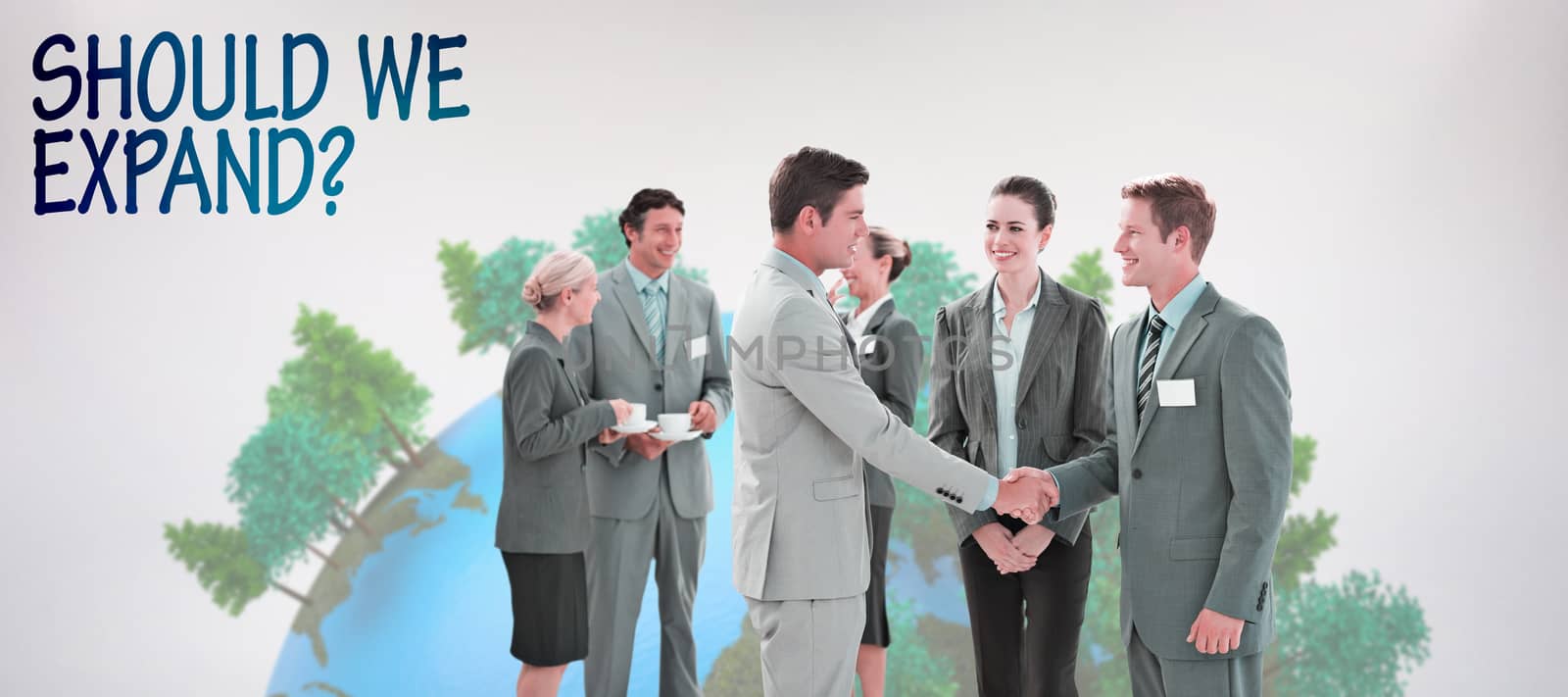 Business people shaking hands  against grey background
