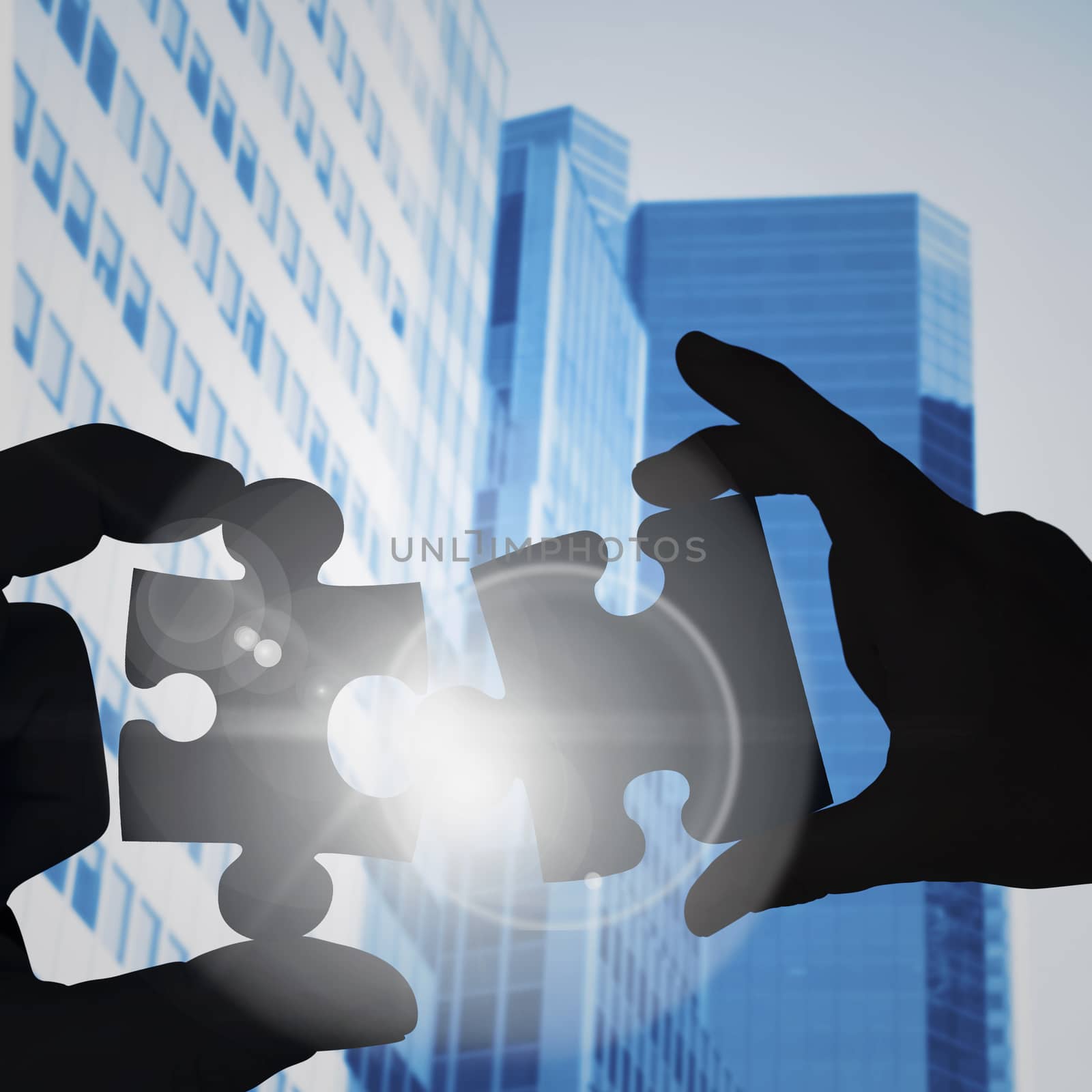 Mid section of a businessman in suit with hands out against low angle view of skyscrapers