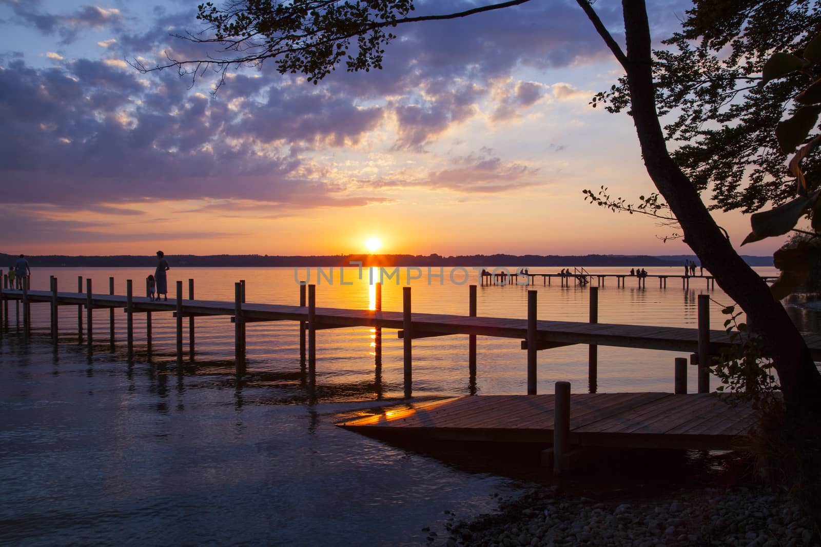 Reflections and jetty at Lake Starnberg  in the evening light