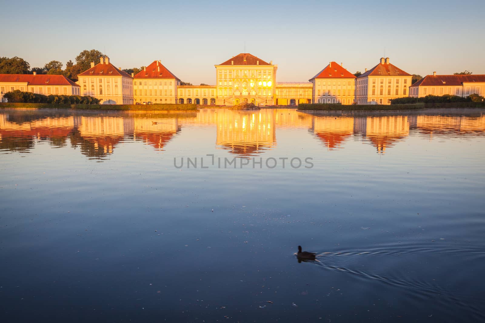 Nymphenburg palace with reflection in the morning sunlight