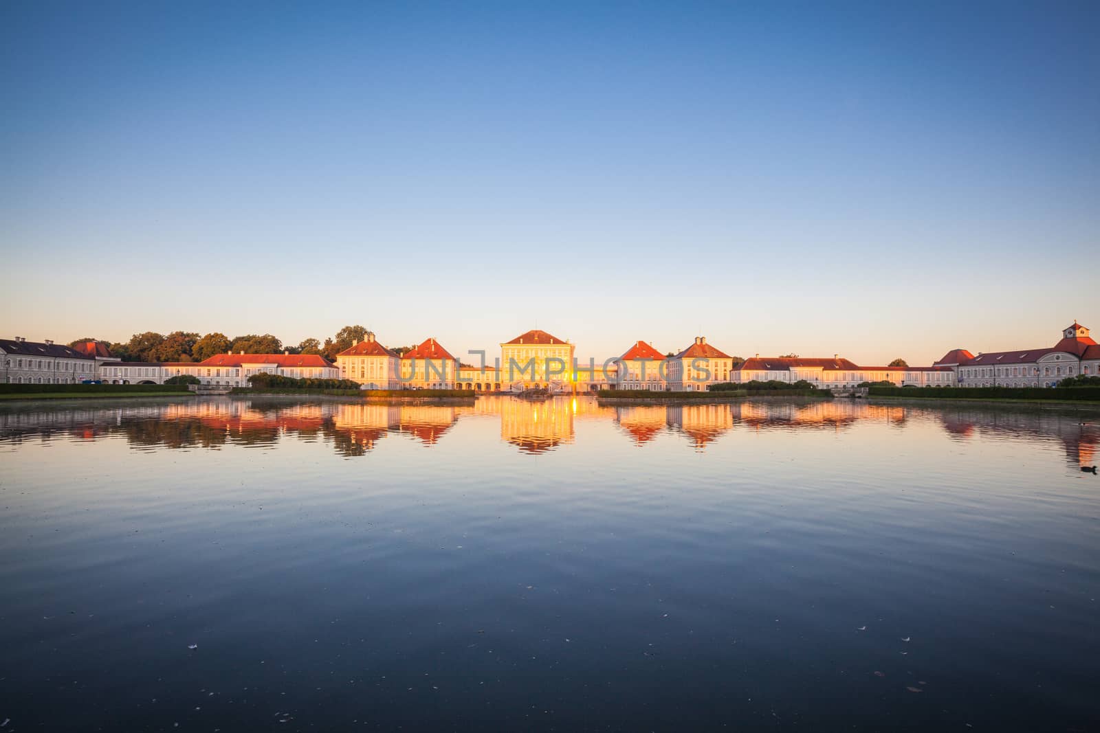 Nymphenburg palace with reflection in the morning sunlight