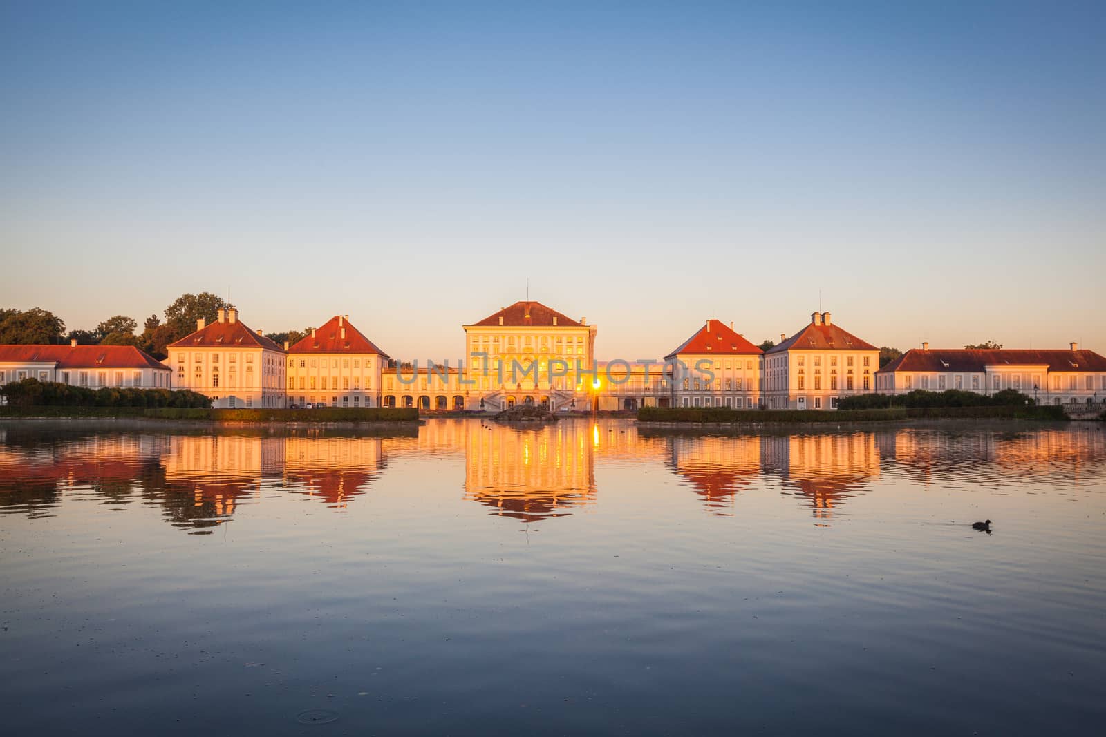 Nymphenburg palace with reflection in the morning sunlight