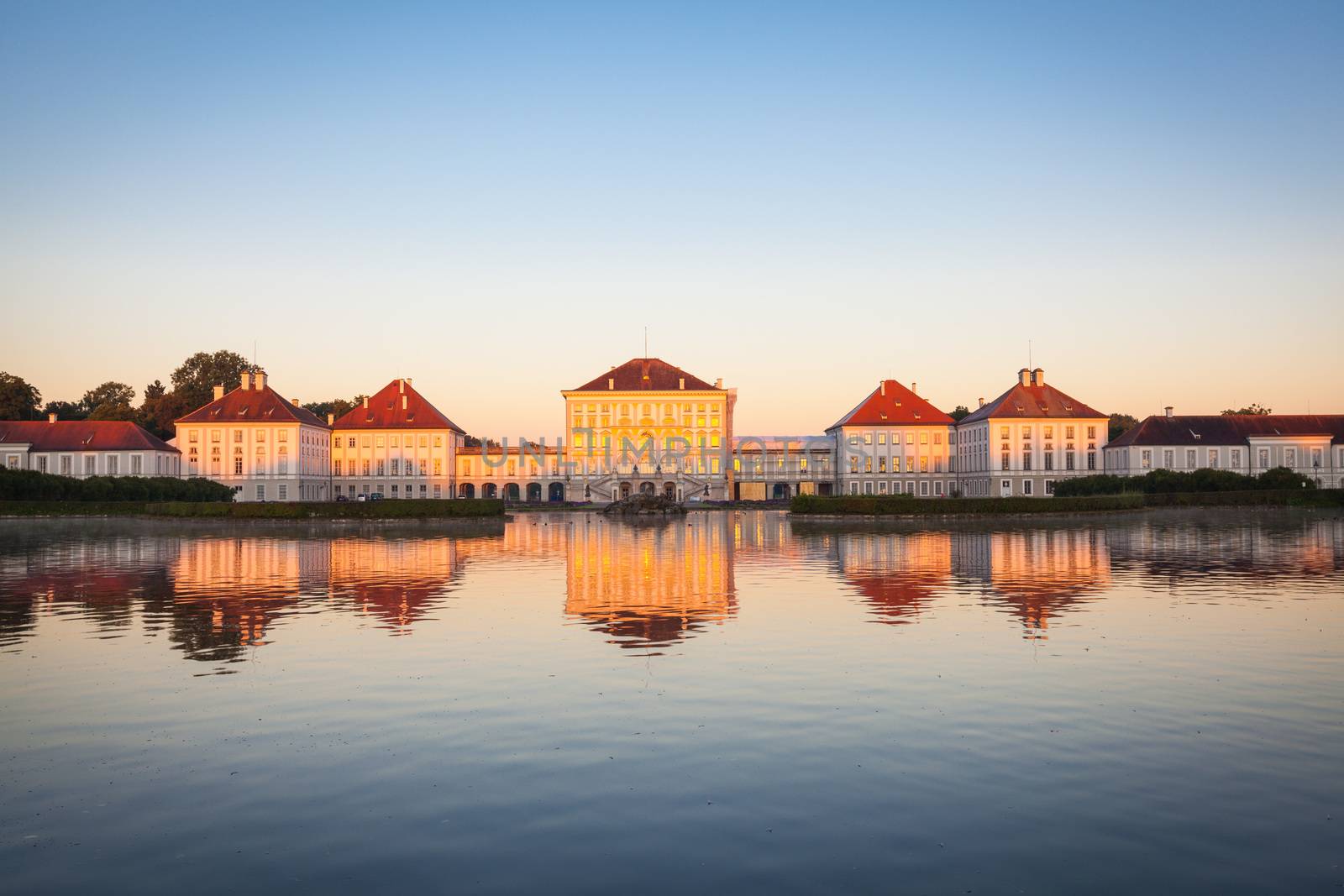 Nymphenburg palace with reflection in the morning sunlight