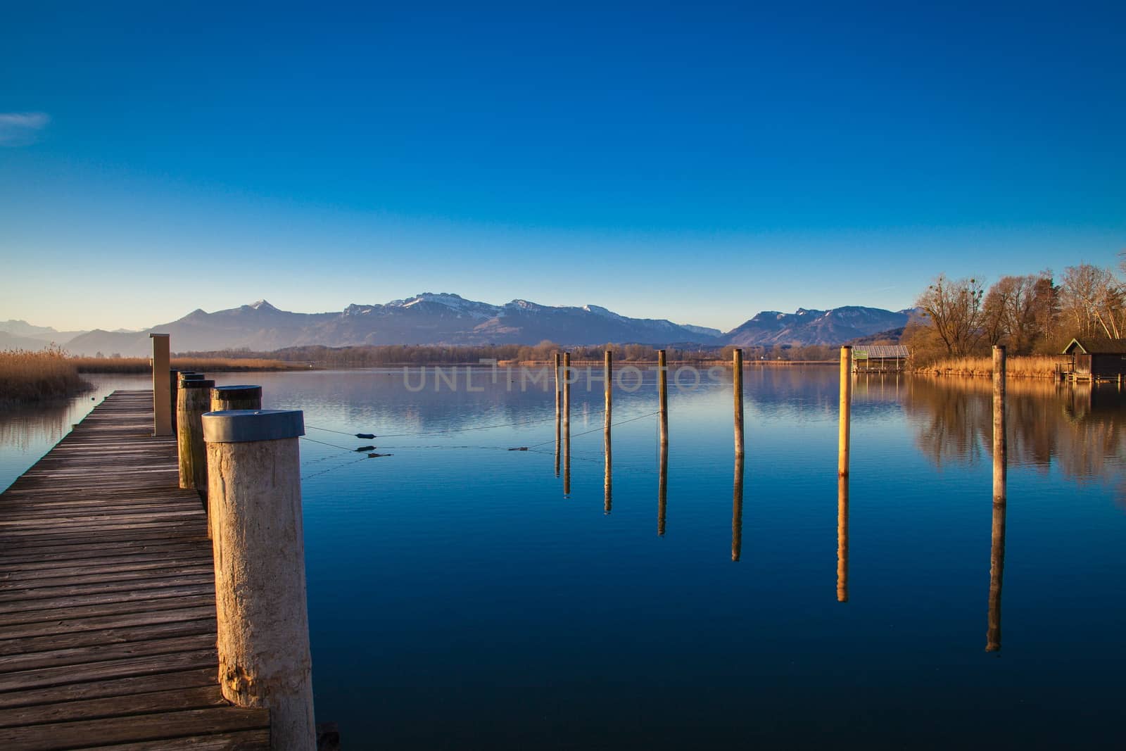 Early morning at a jetty at lake Chiemsee