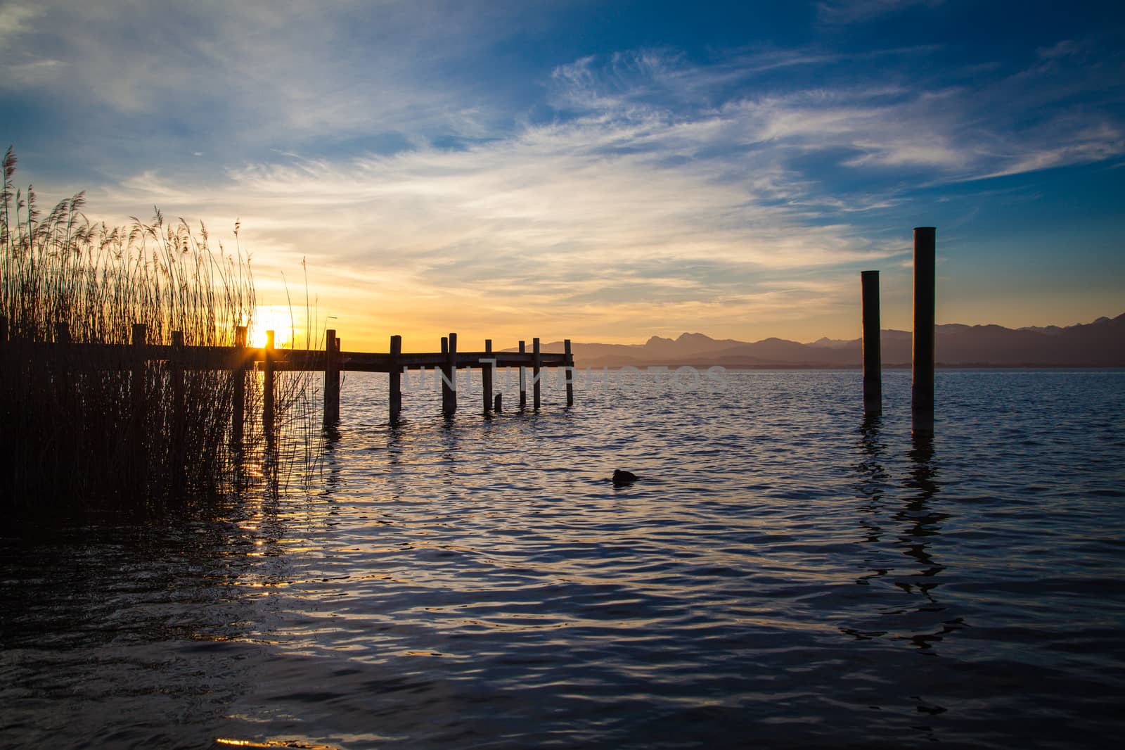 Early morning at a jetty at lake Chiemsee