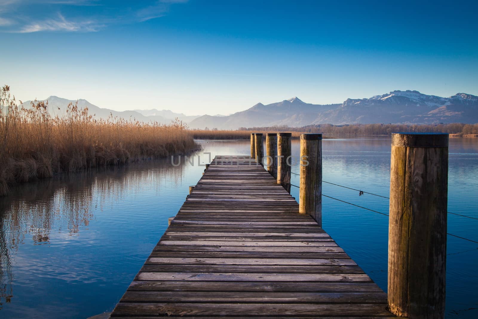 Early morning at a jetty at lake Chiemsee