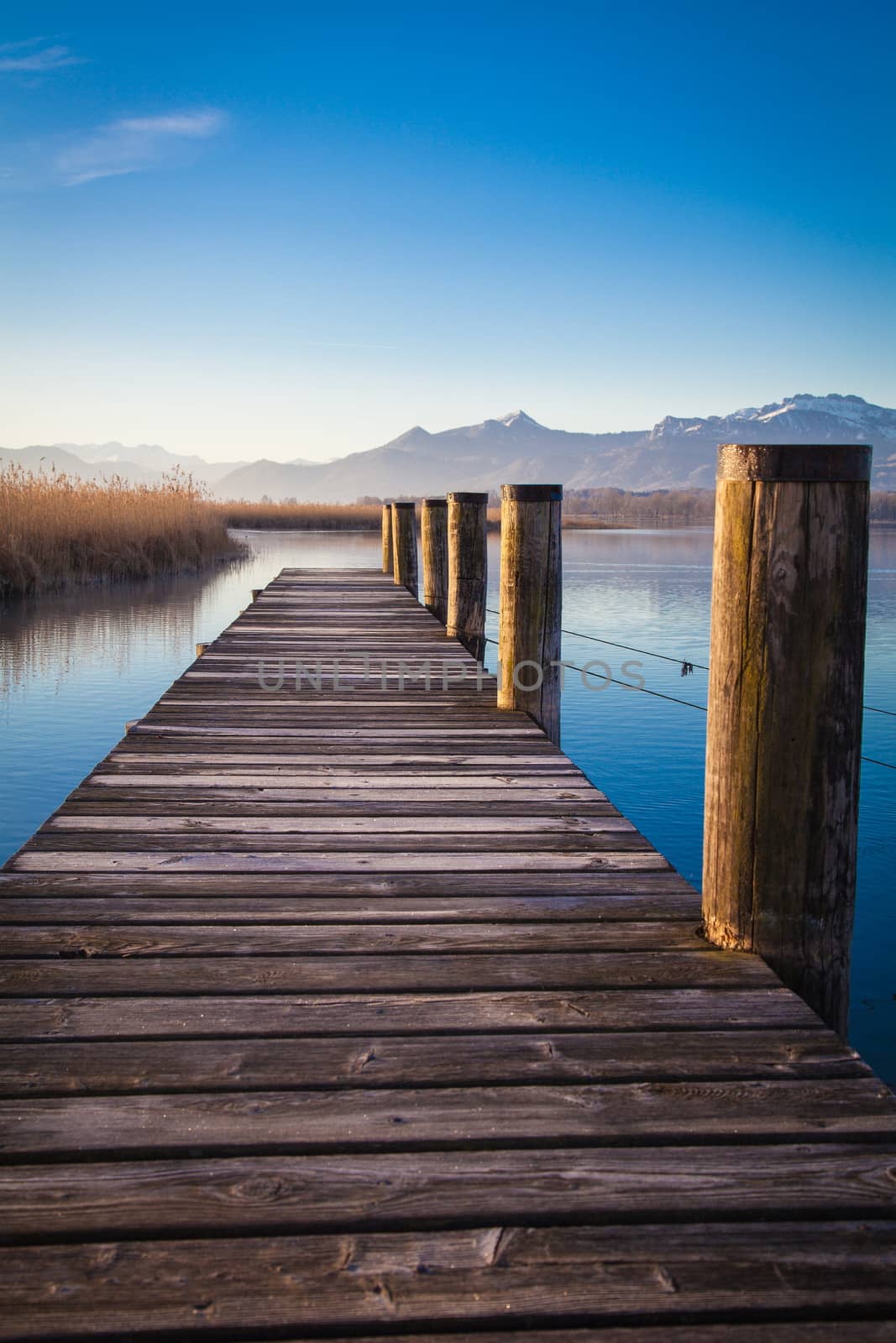 Early morning at a jetty at lake Chiemsee