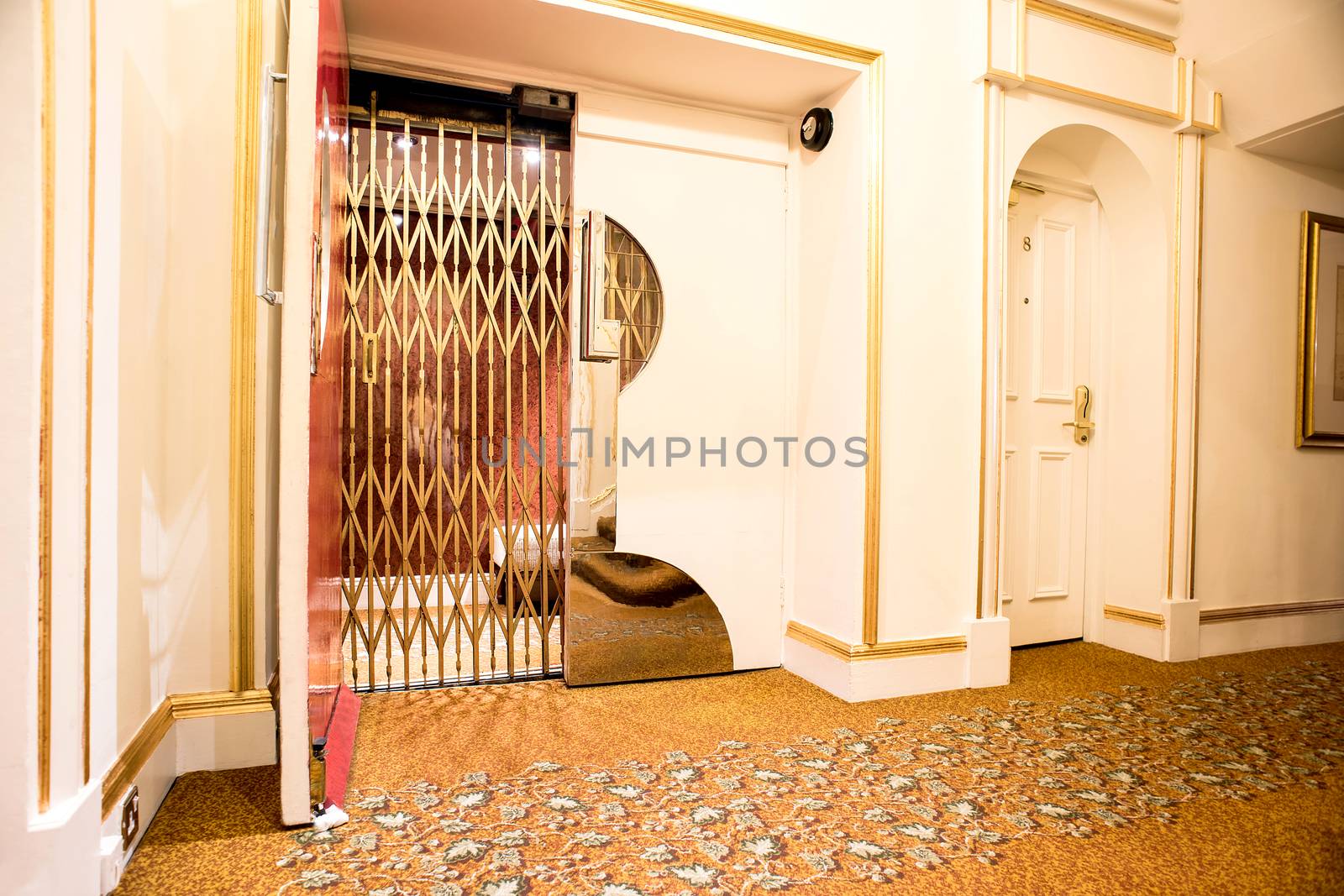 Old vintage lift at hotel lobby by stockyimages