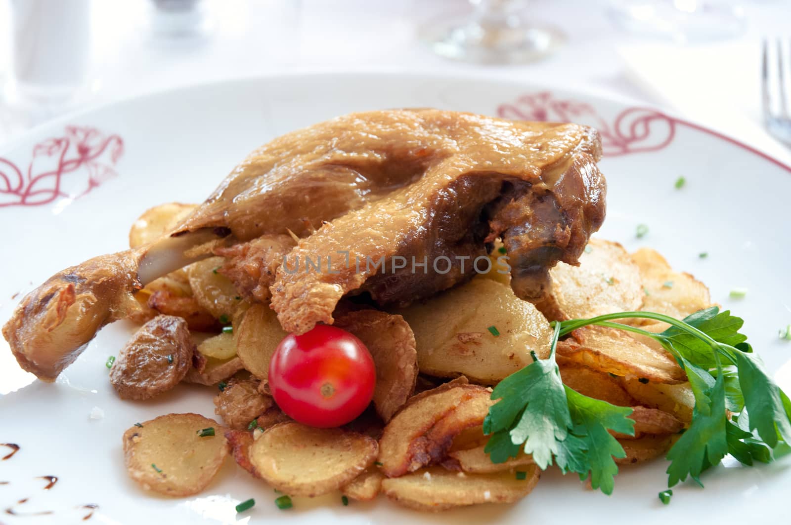 Duck confit, roasted duck leg with potatoes . by LarisaP