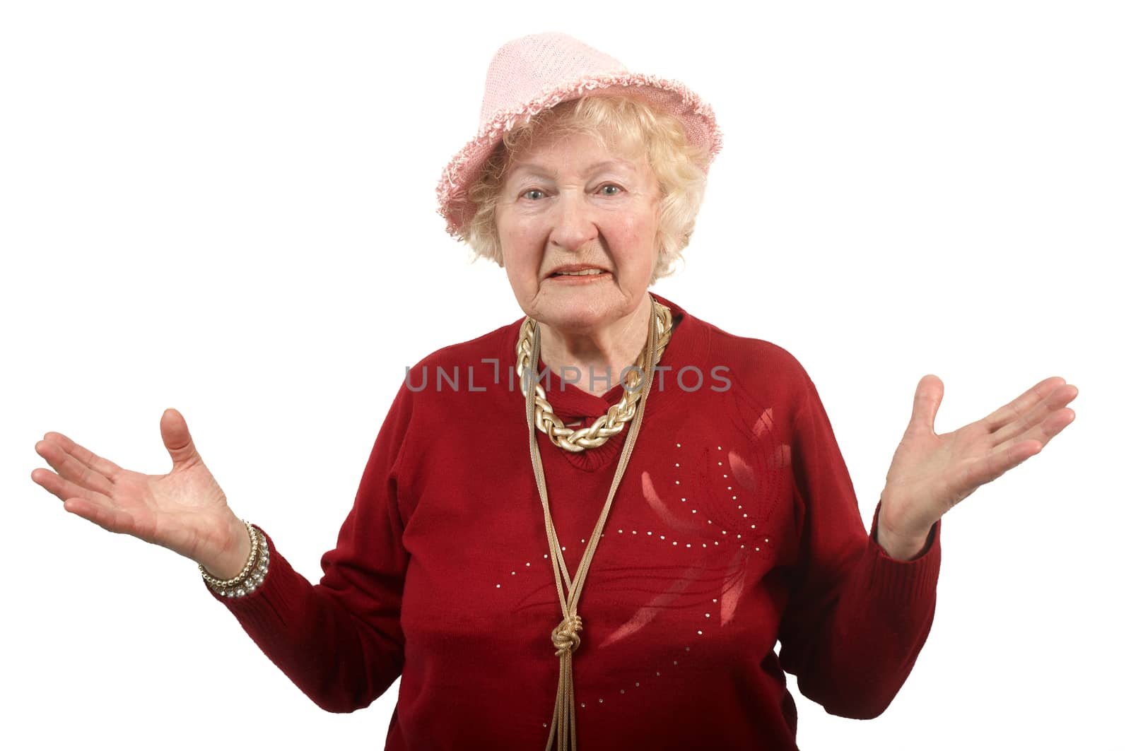 Portrait of  80 years old cheerful woman  in a pink hat .