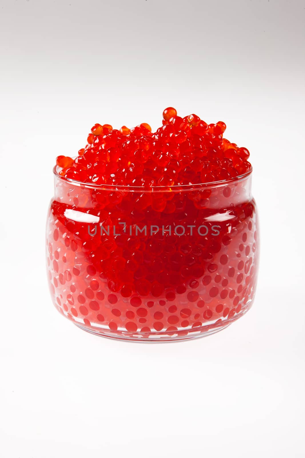Red caviar on an isolated studio background